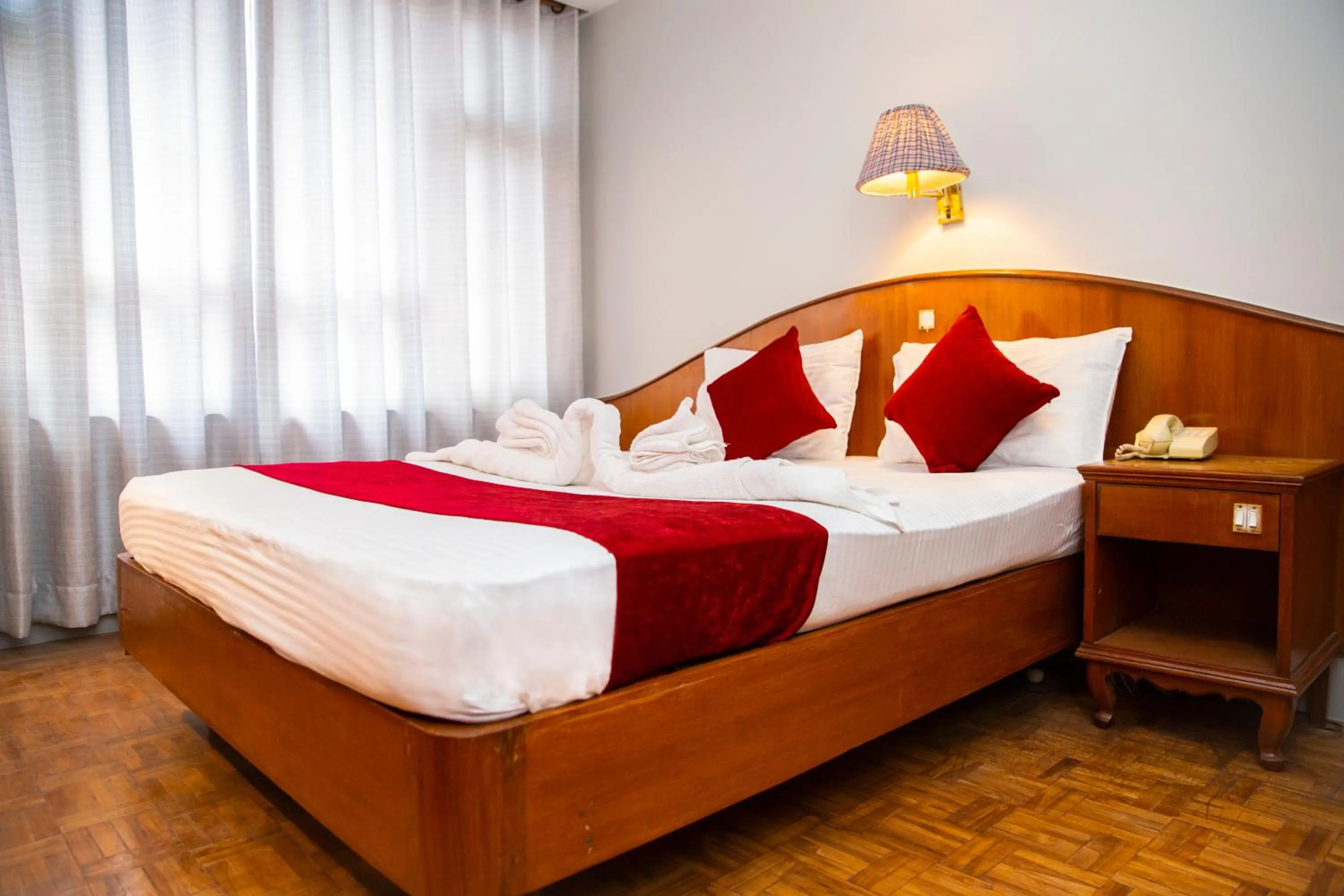 Bed in Mystic Homes Hotel