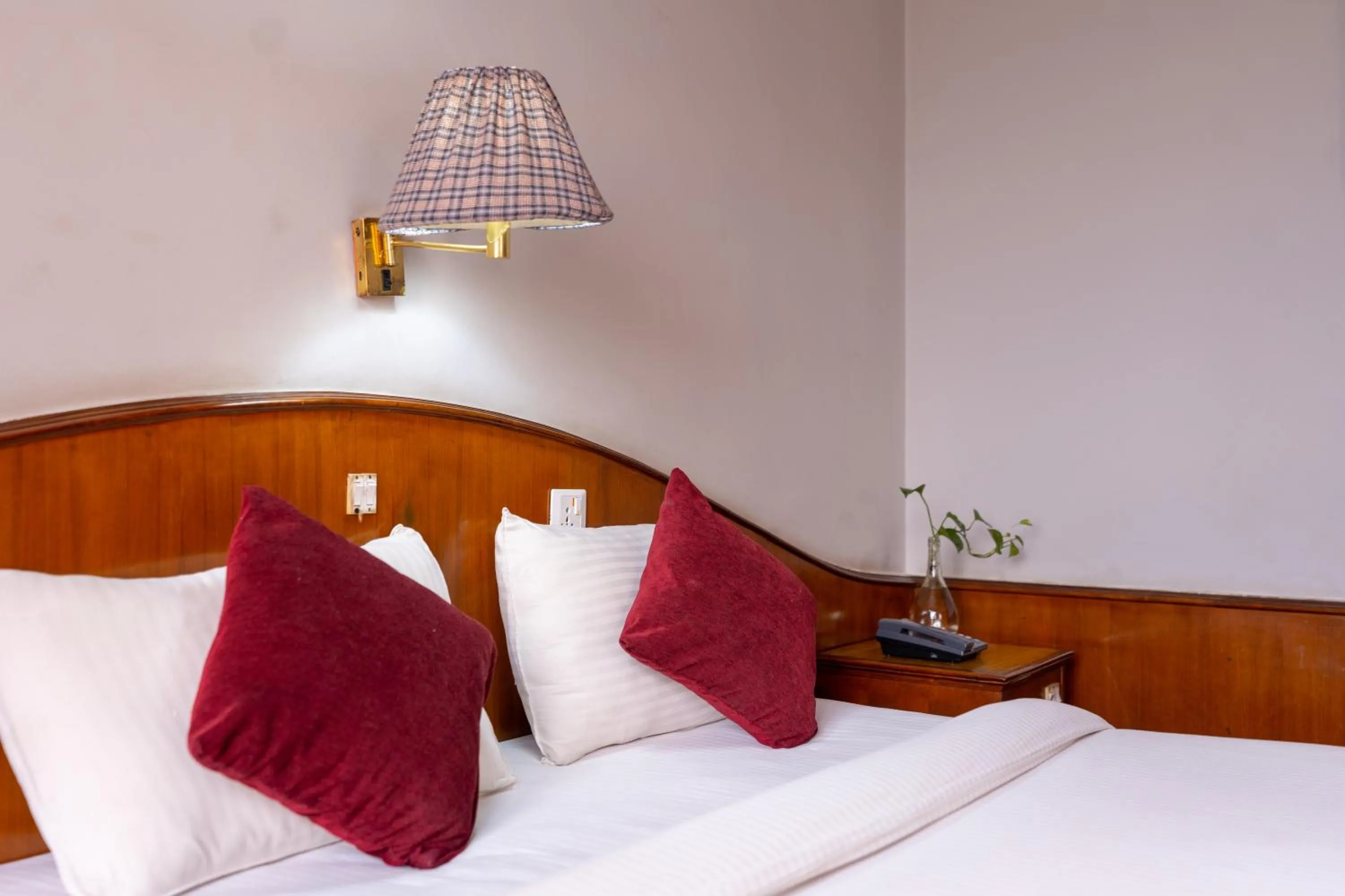 Bed in Mystic Homes Hotel