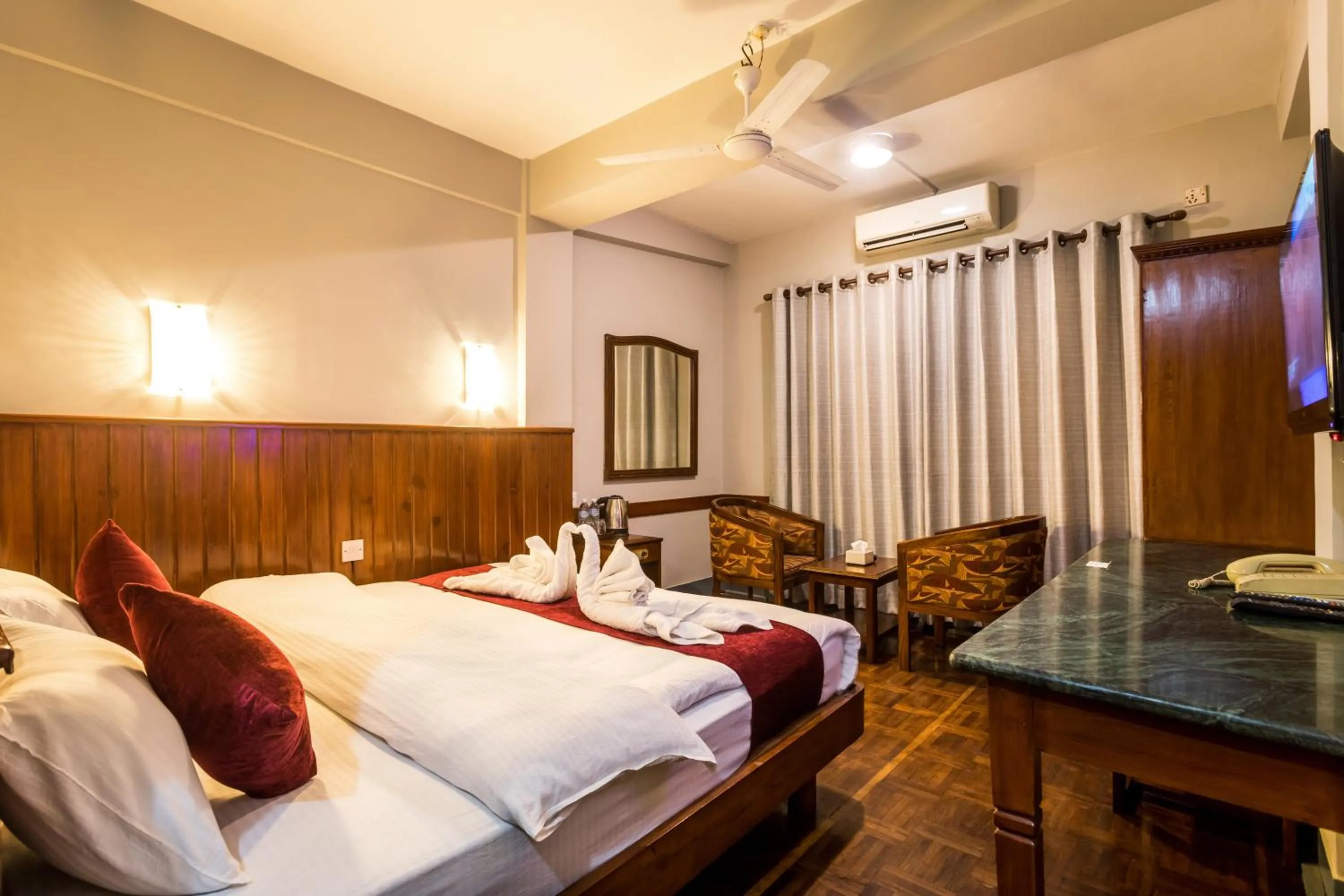 Bed in Mystic Homes Hotel