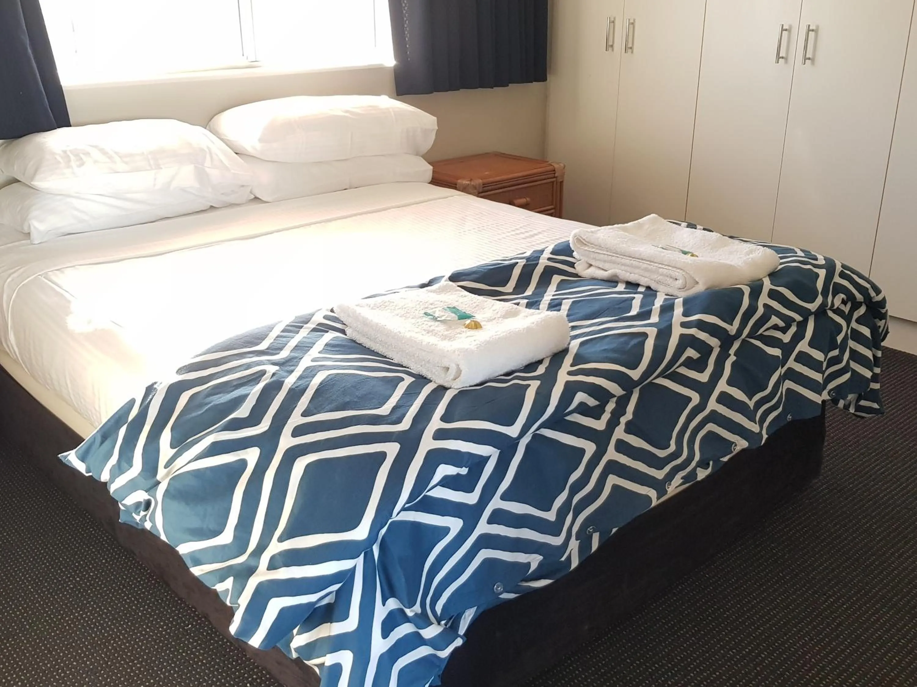 Bed in Excellsior Apartments