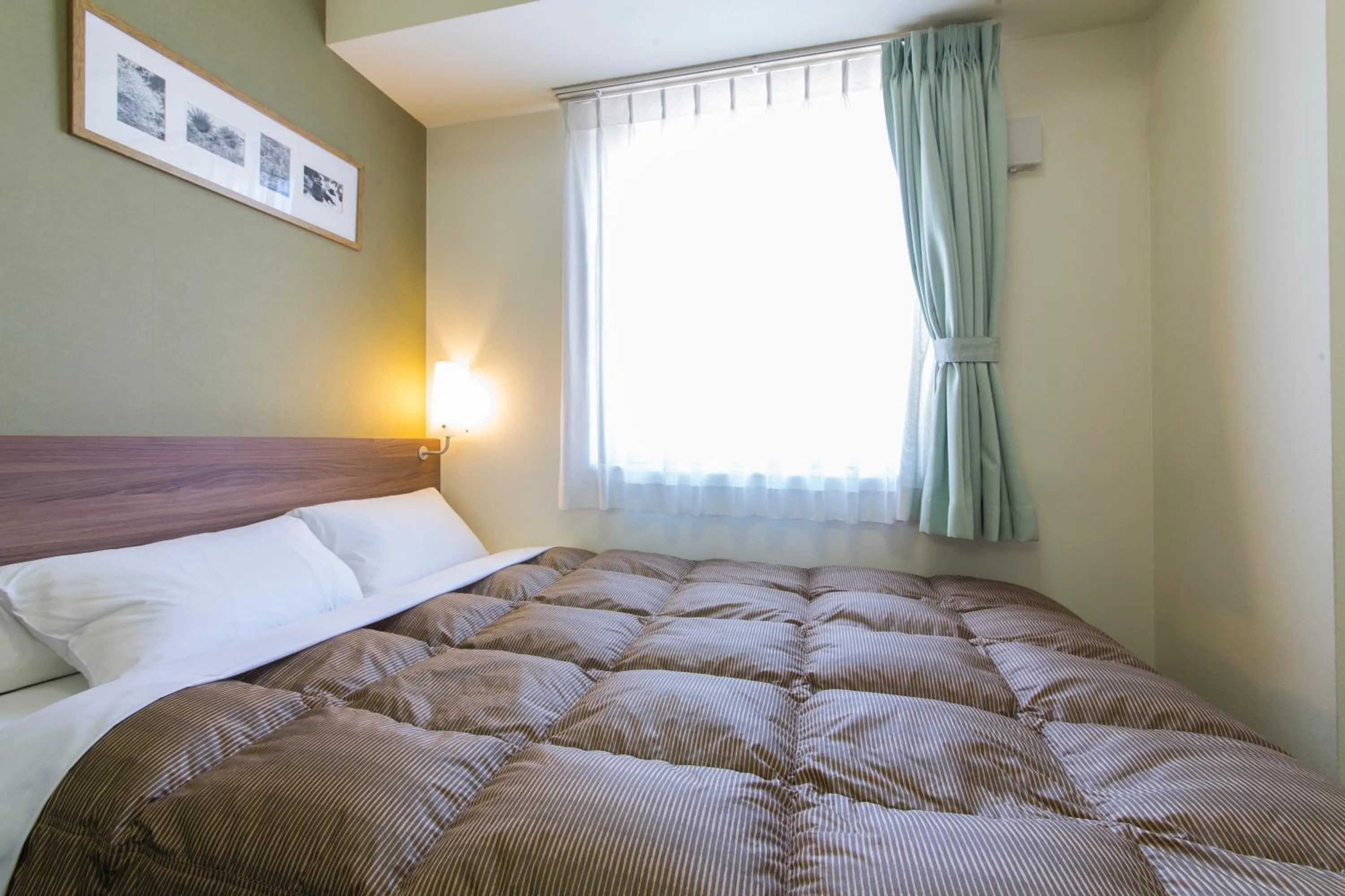 Photo of the whole room, Bed in Hotel Econo Kameyama