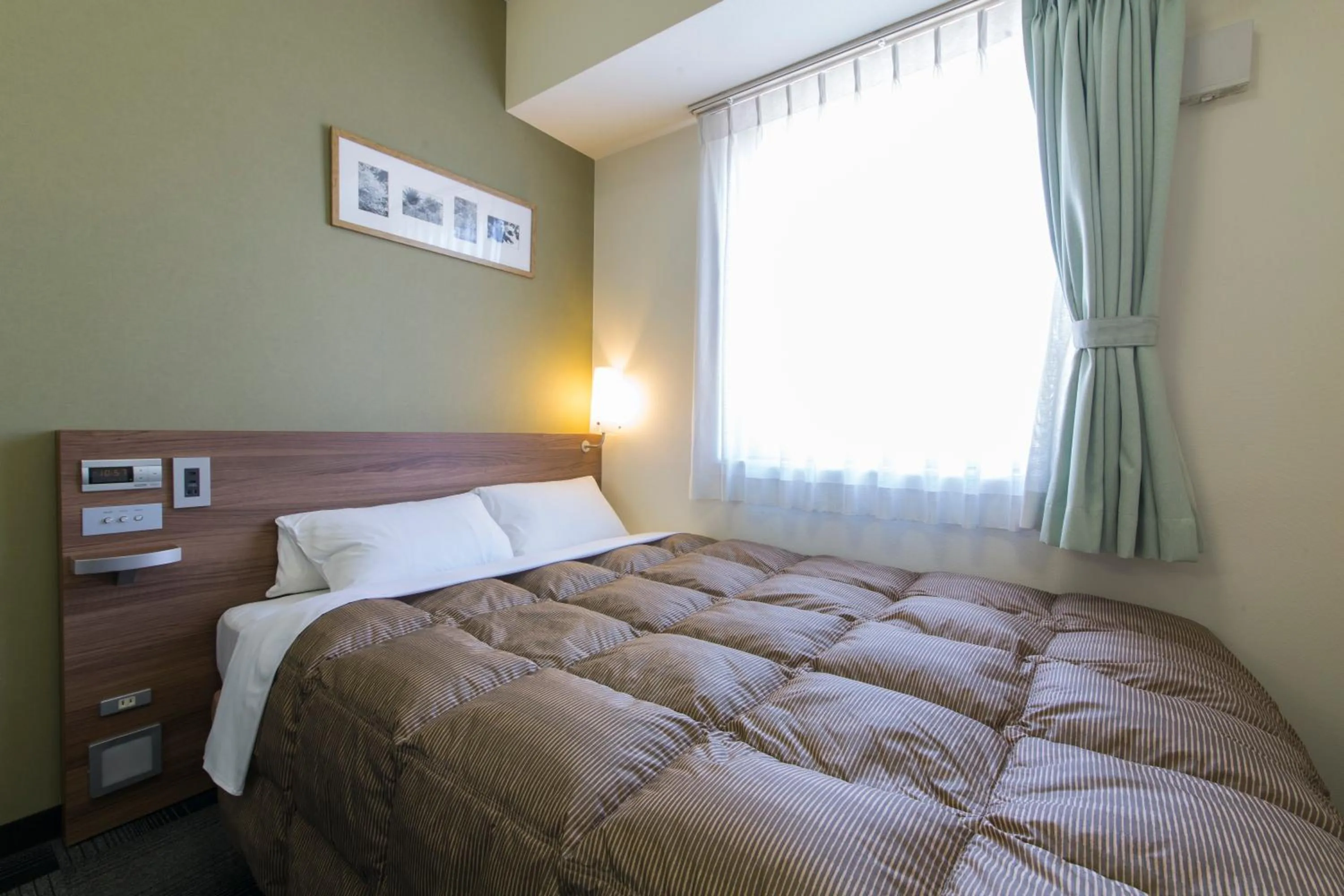 Photo of the whole room, Bed in Hotel Econo Kameyama