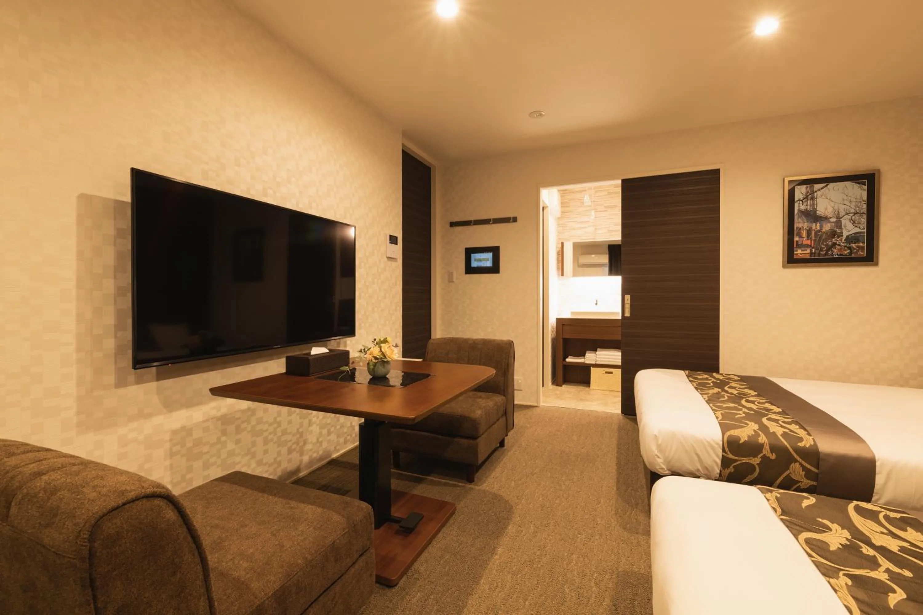 Photo of the whole room, Bed in GRAND BASE Nagasaki Ekimae