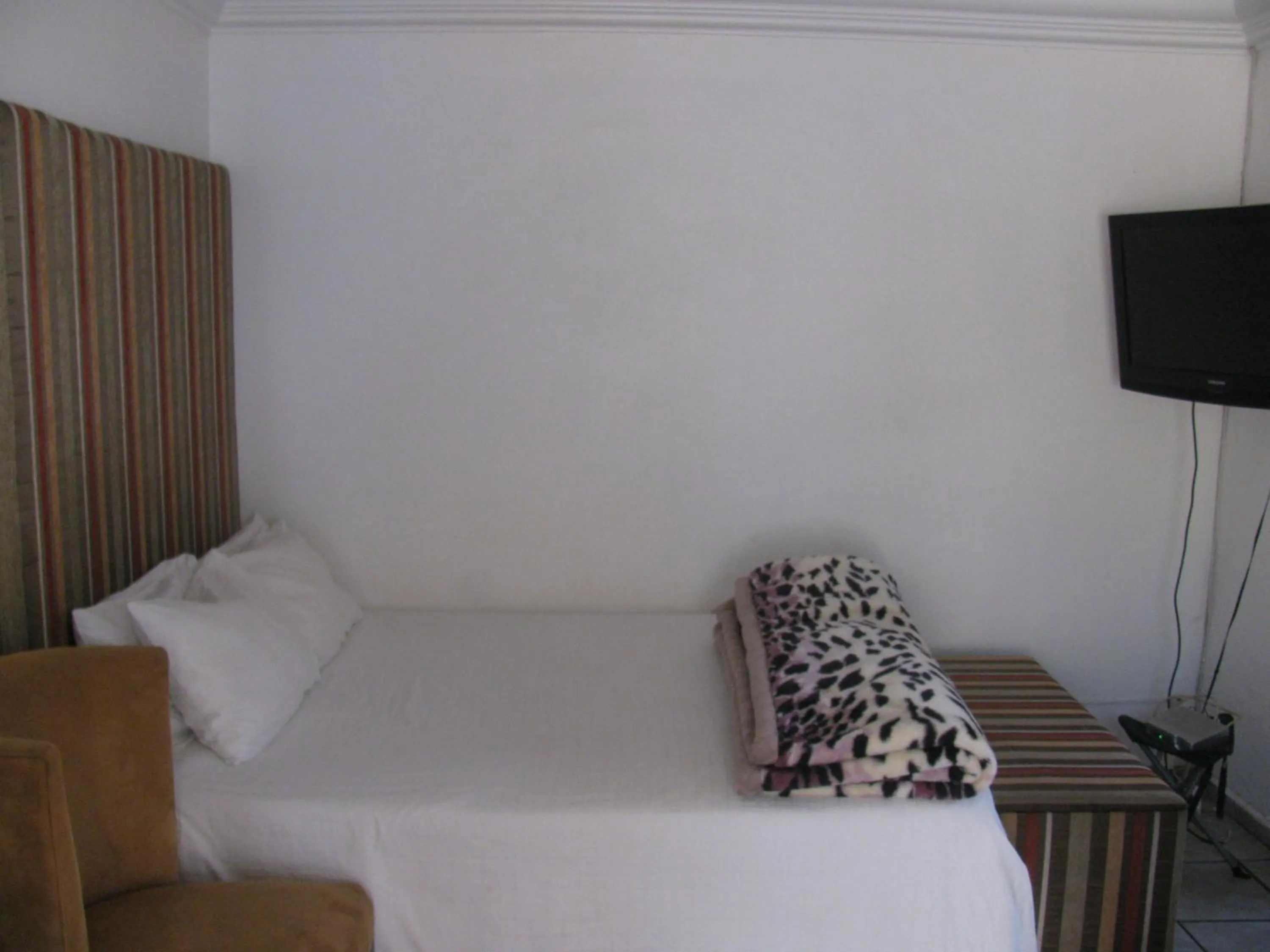 Bed in Bruno Comfort Suites