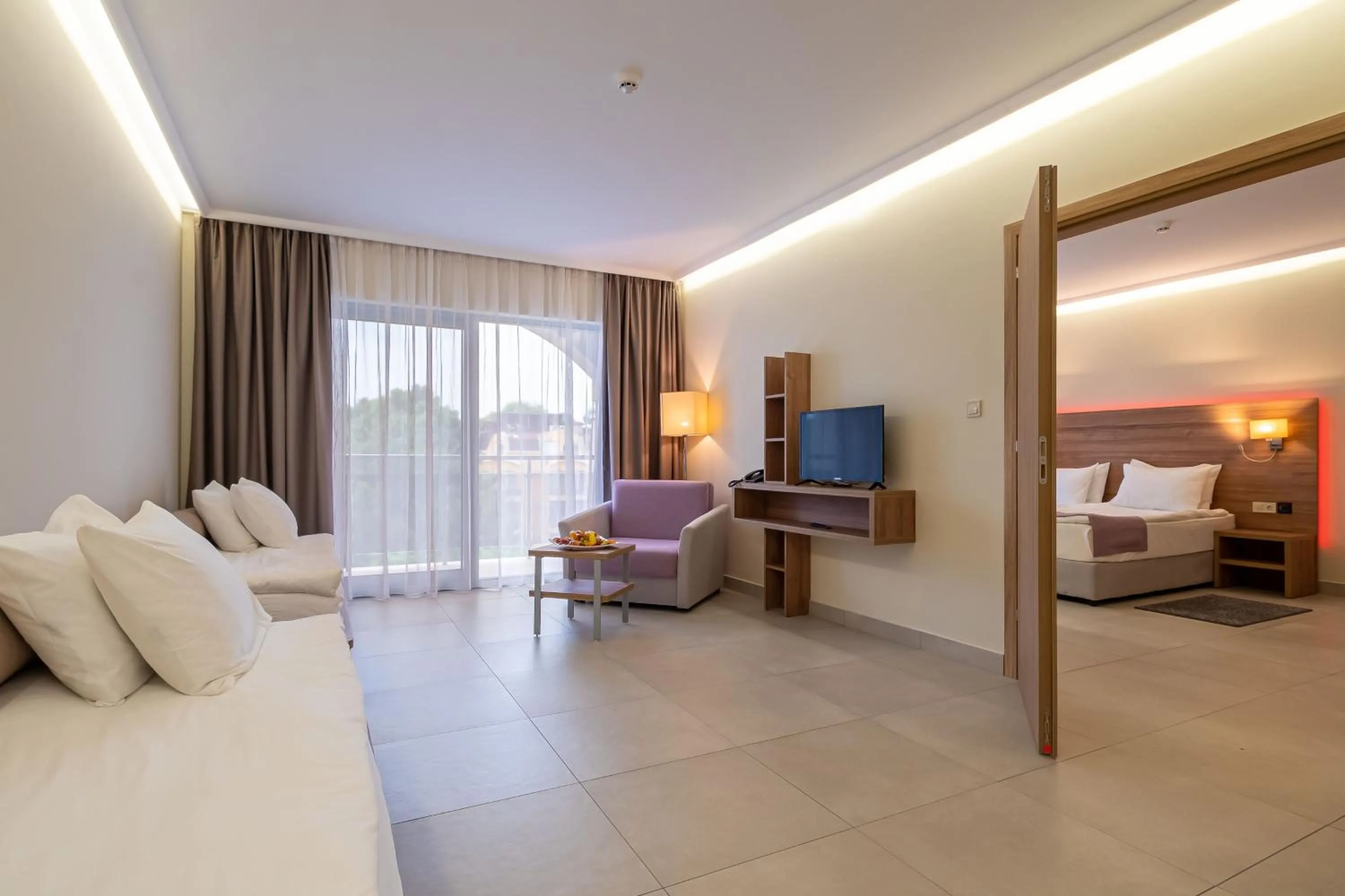 Living room, Bed in Belvedere Hotel - All inclusive