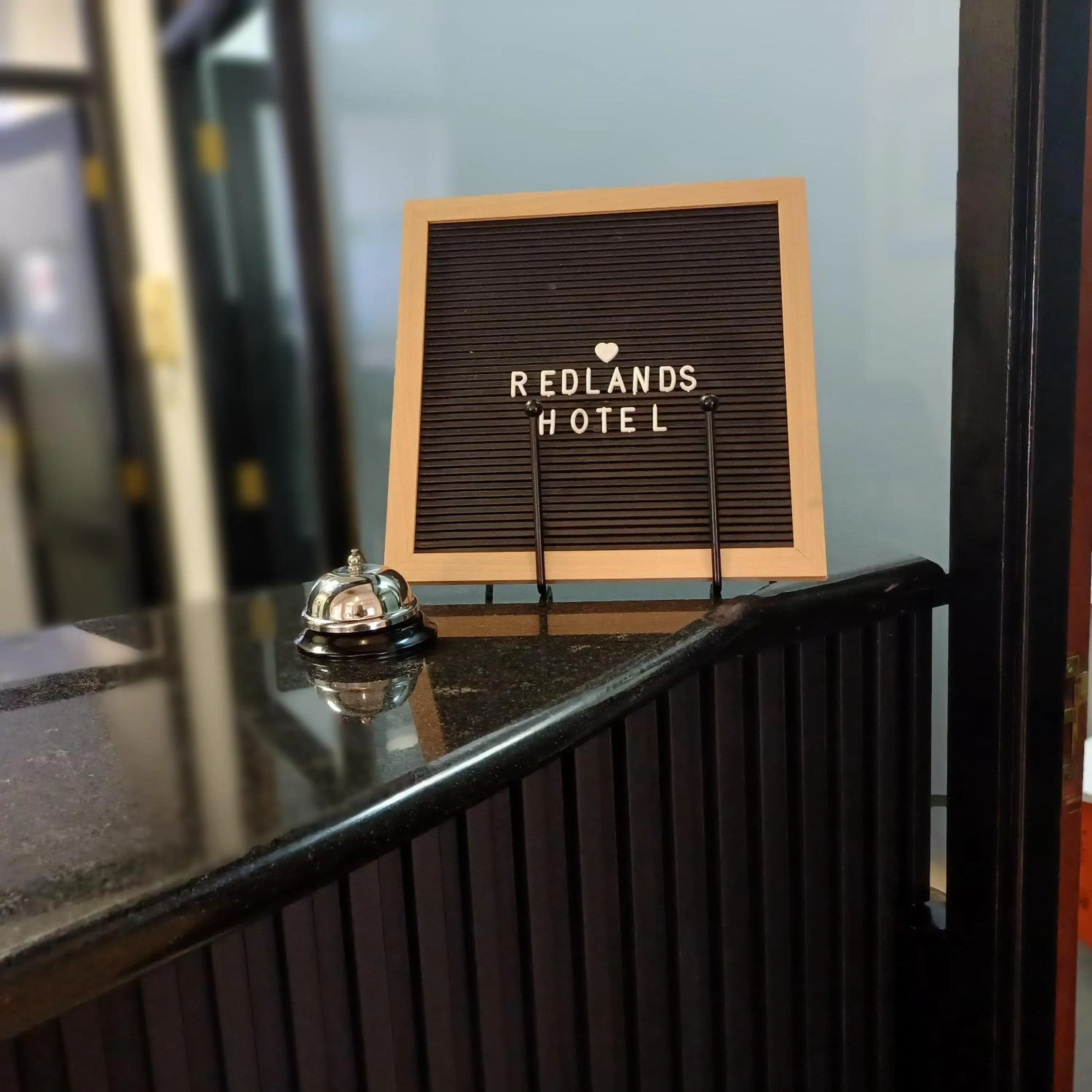 Property logo or sign in Redlands Hotel