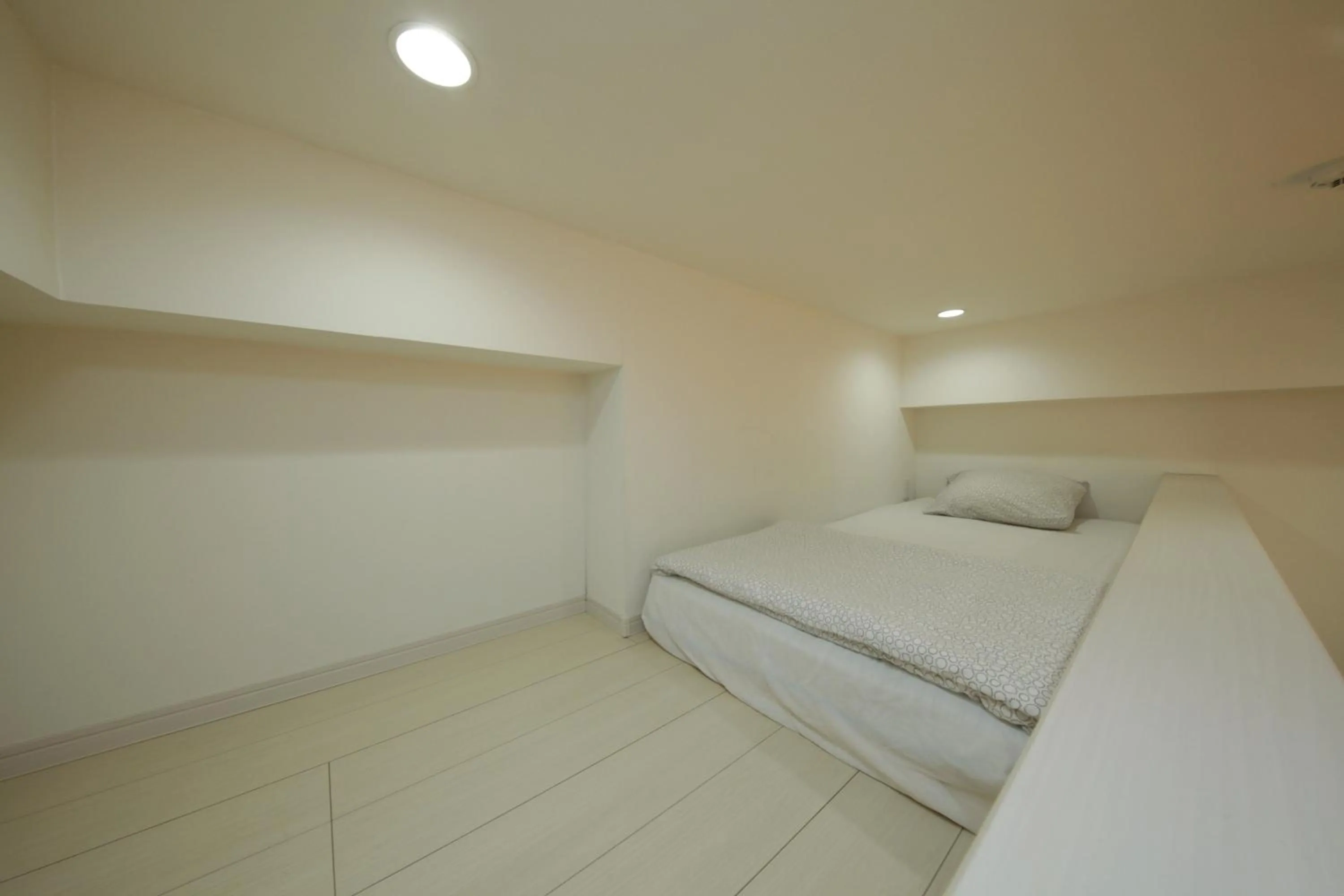 Bed in Nano North Shinjuku Apartment by Tranova