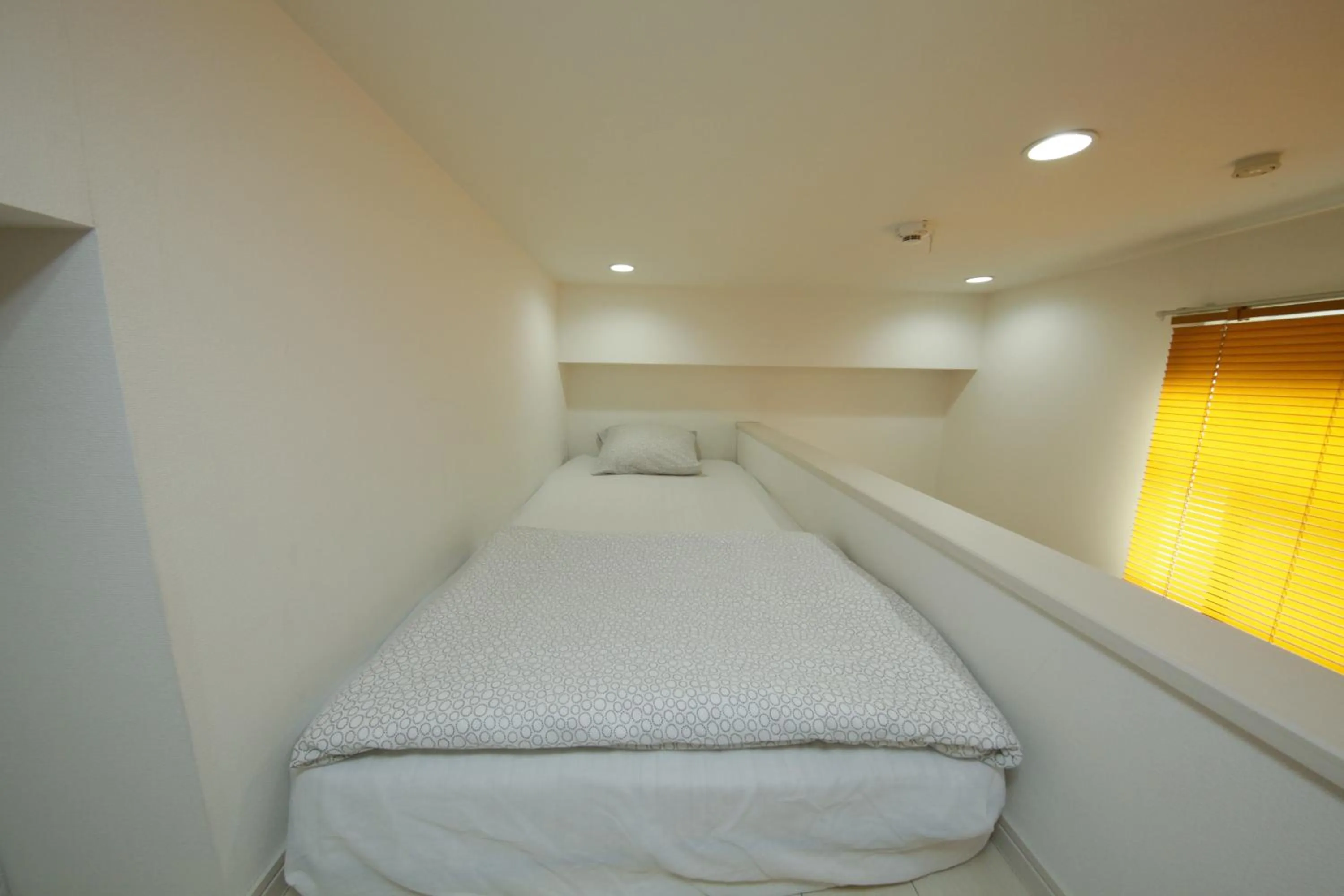 Bed in Nano North Shinjuku Apartment by Tranova