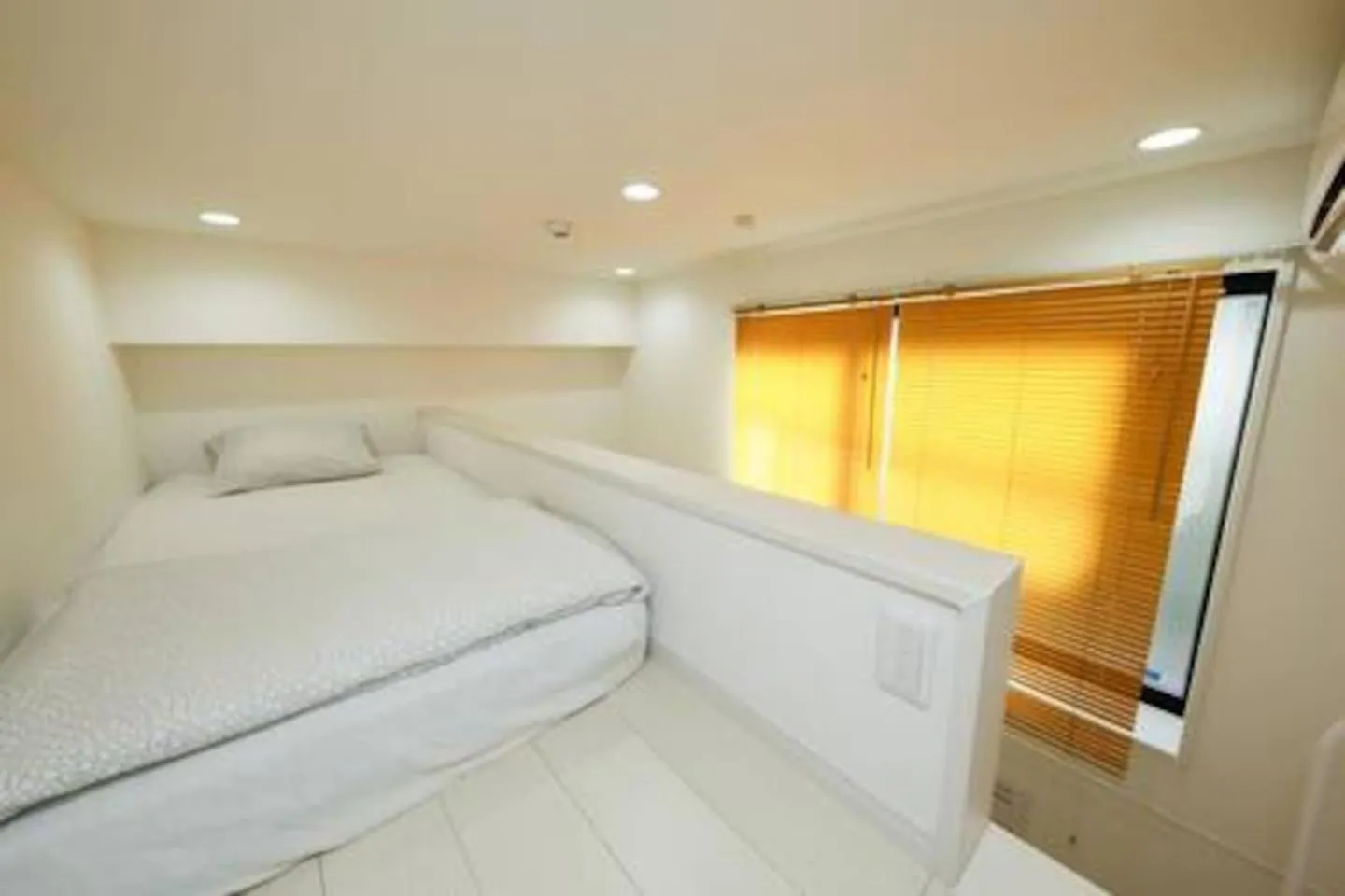 Bed in Nano North Shinjuku Apartment by Tranova