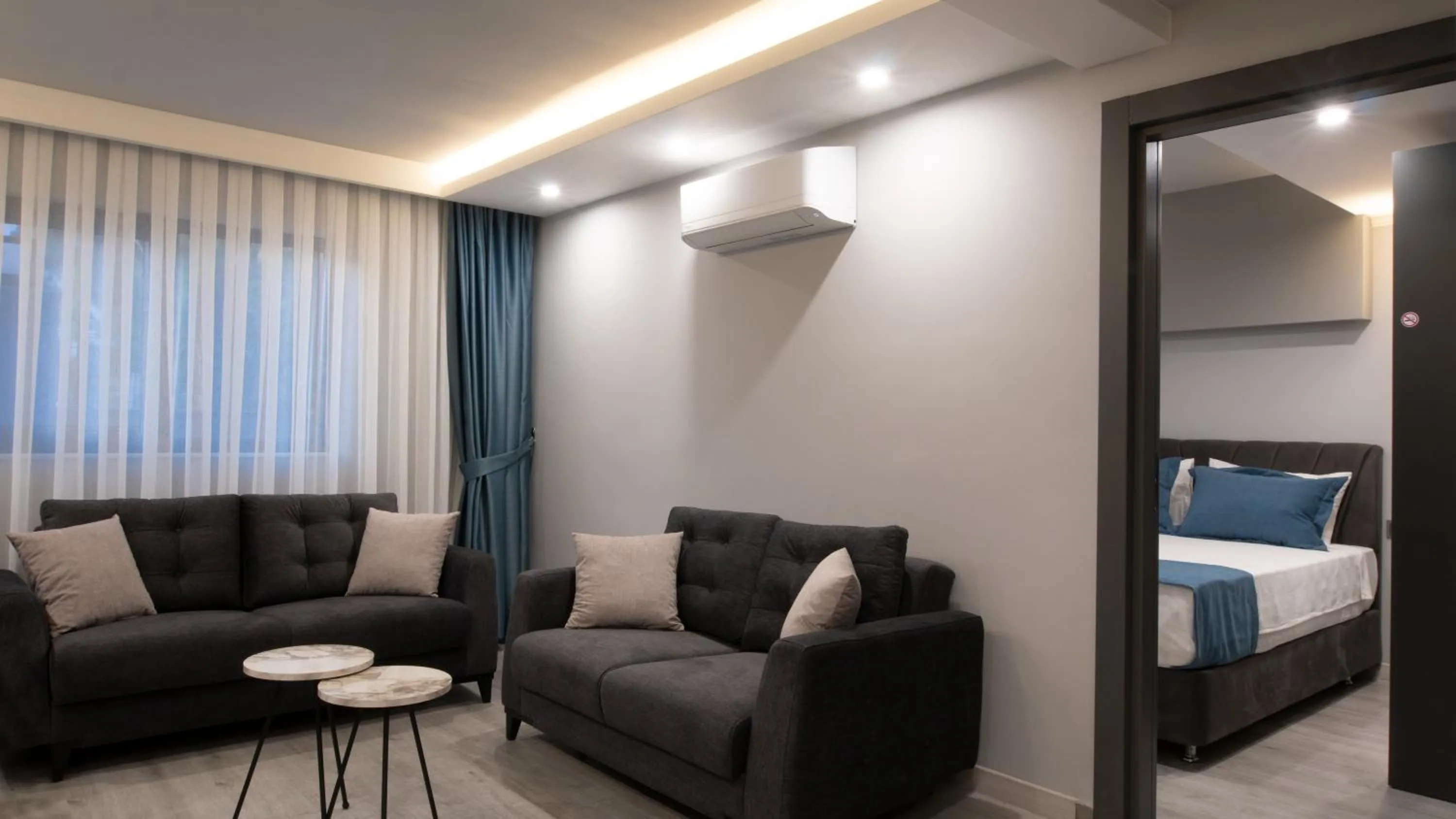 Living room, Bed in OPERA SUITES Apart Hotel