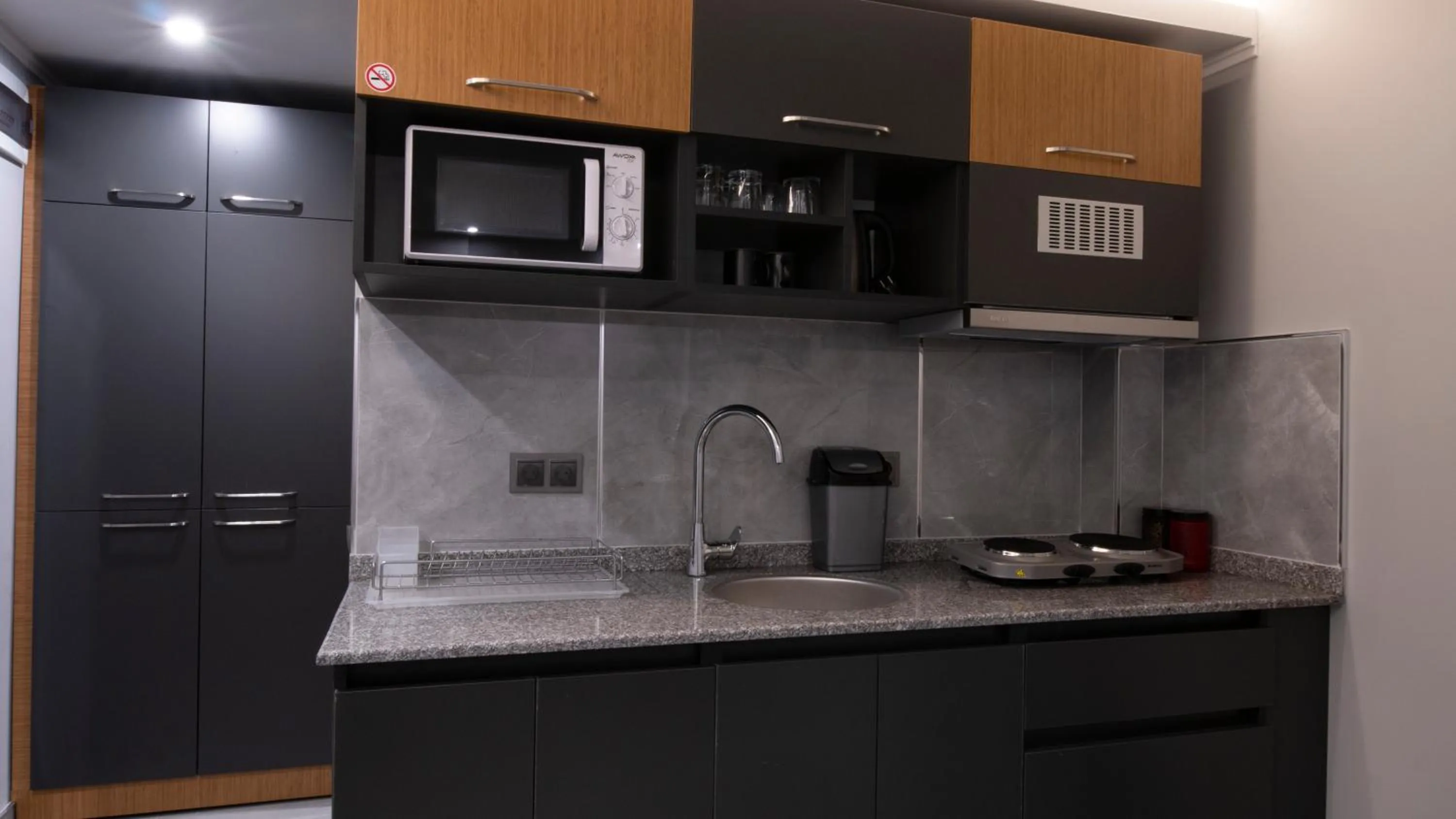 Kitchen or kitchenette in OPERA SUITES Apart Hotel