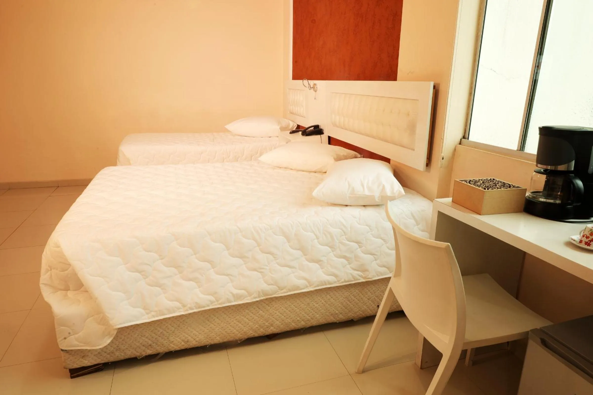 Bed in Emirates Hotel & Suites