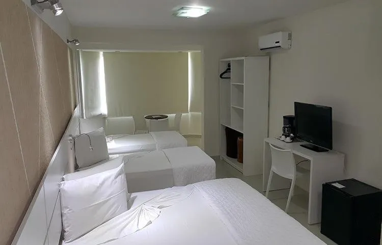 Communal lounge/ TV room, Bed in Emirates Hotel & Suites