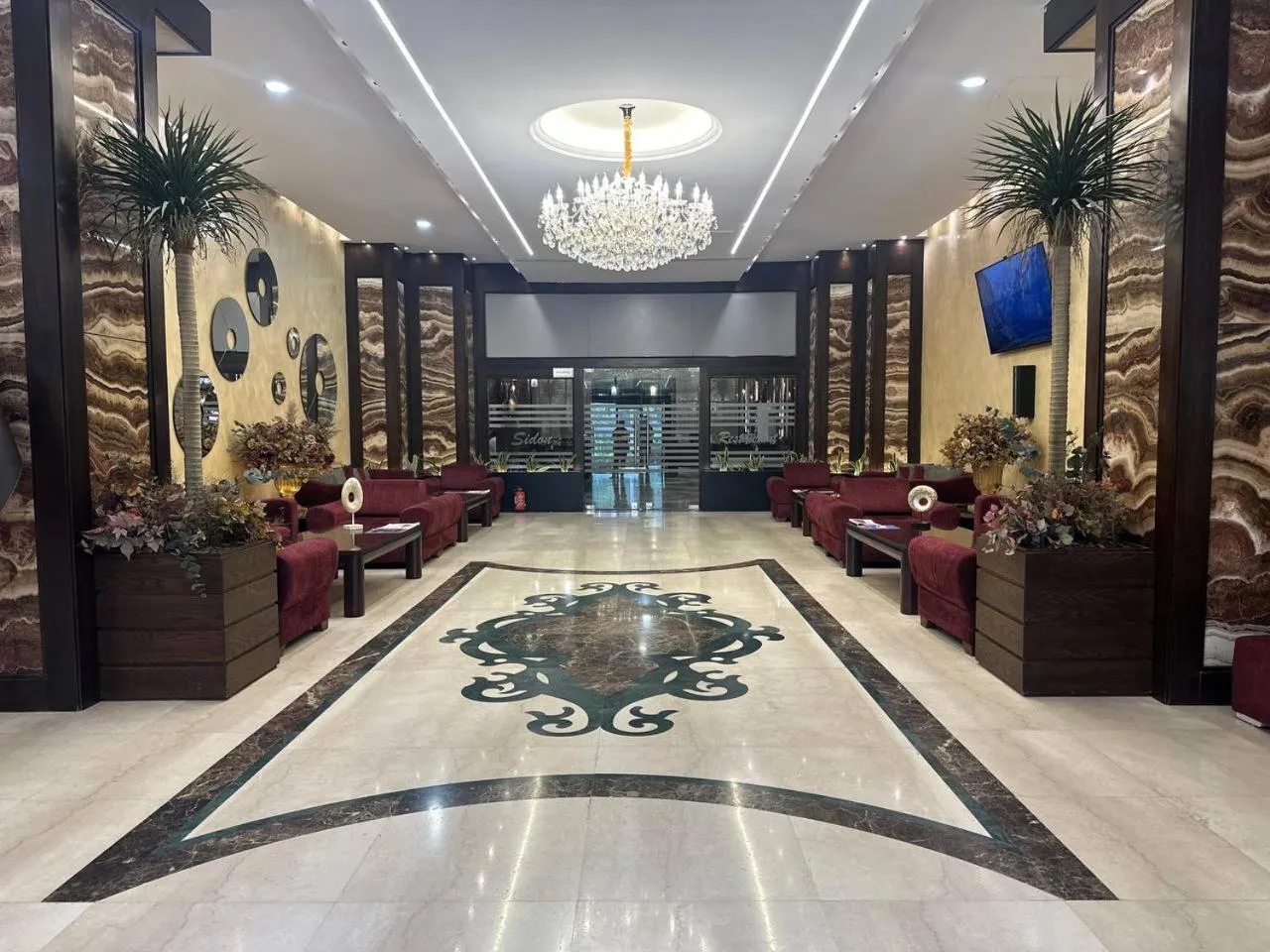 Communal lounge/ TV room in Jouhayna Hotel&Suite