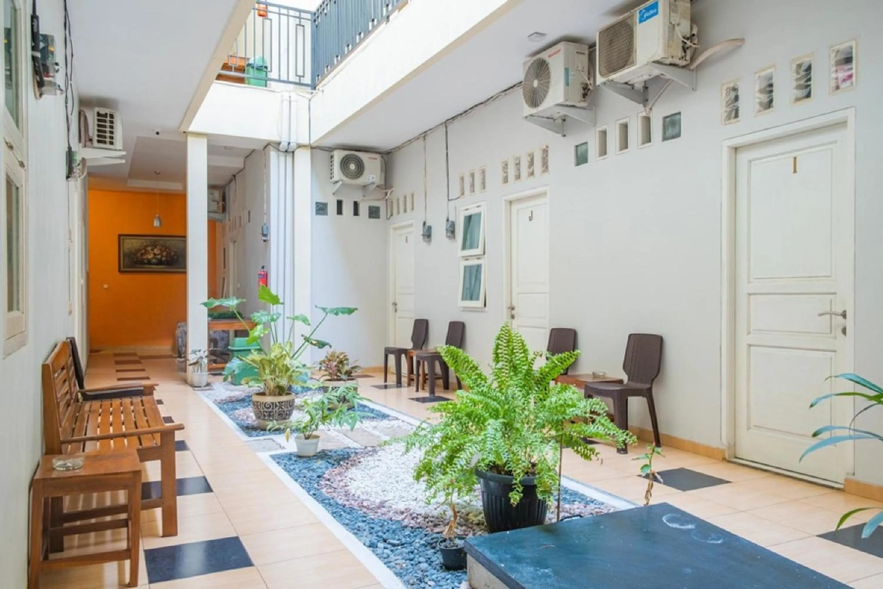 Seating area in RedDoorz Syariah near Grand Kota Bintang