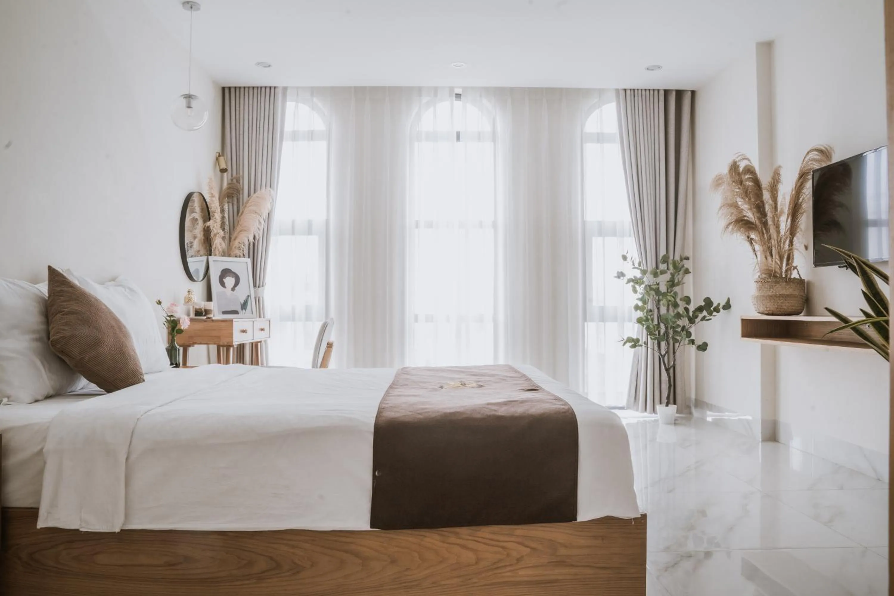 Bed in Maple Suite Hotel & Apartment