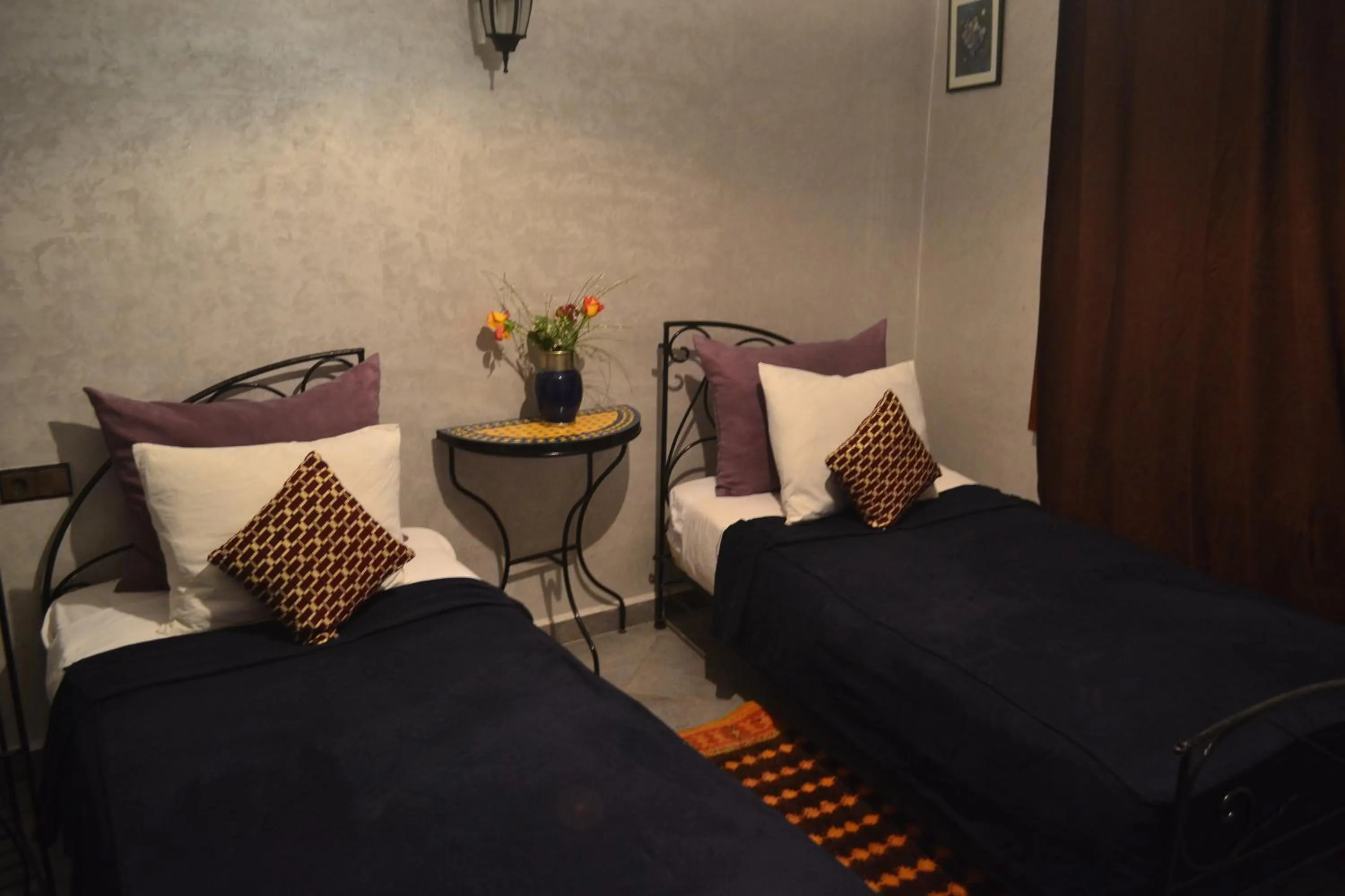 Bed in Riad Hôtel Belleville Marrakech