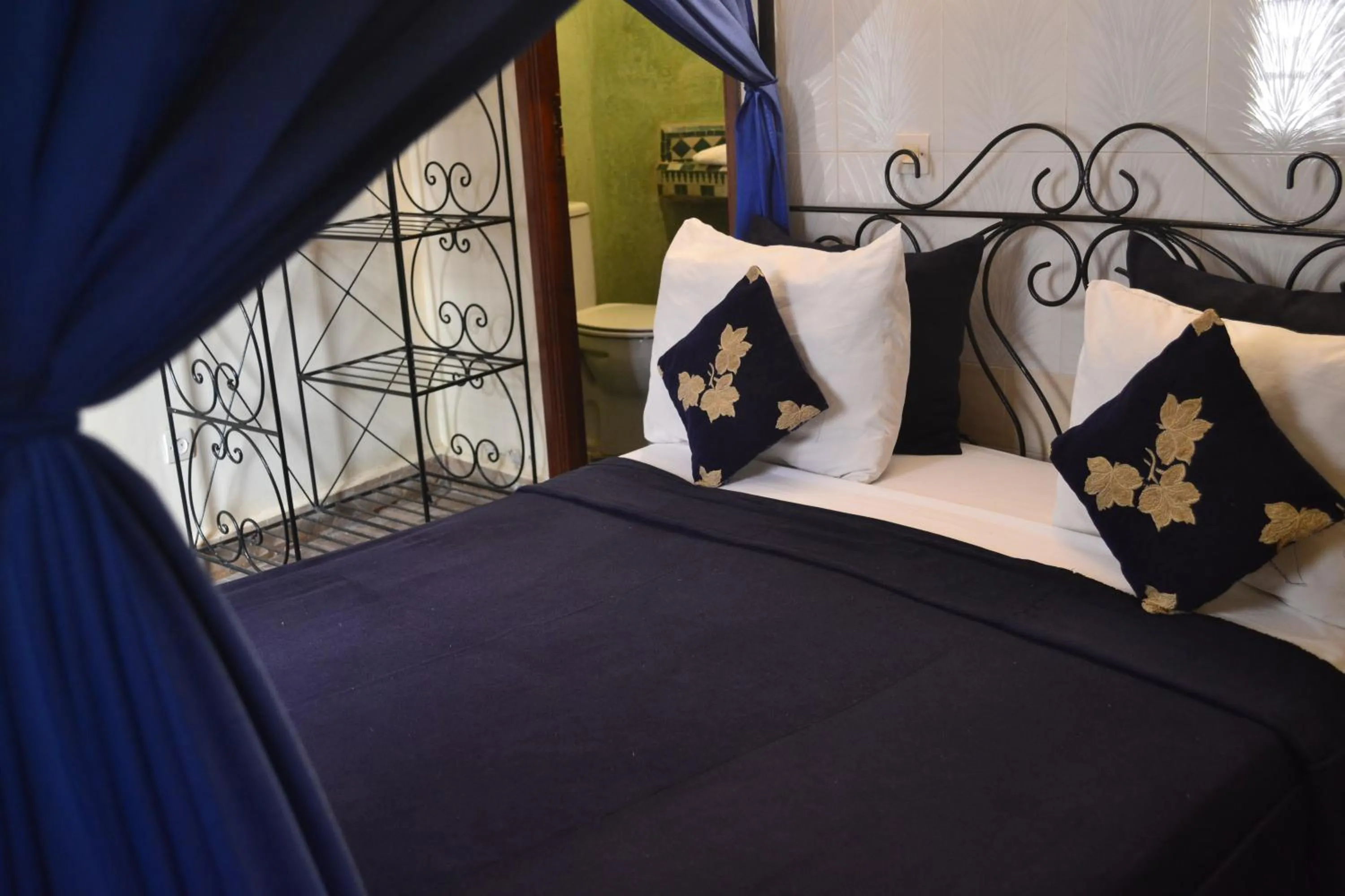 Bed in Riad Hôtel Belleville Marrakech