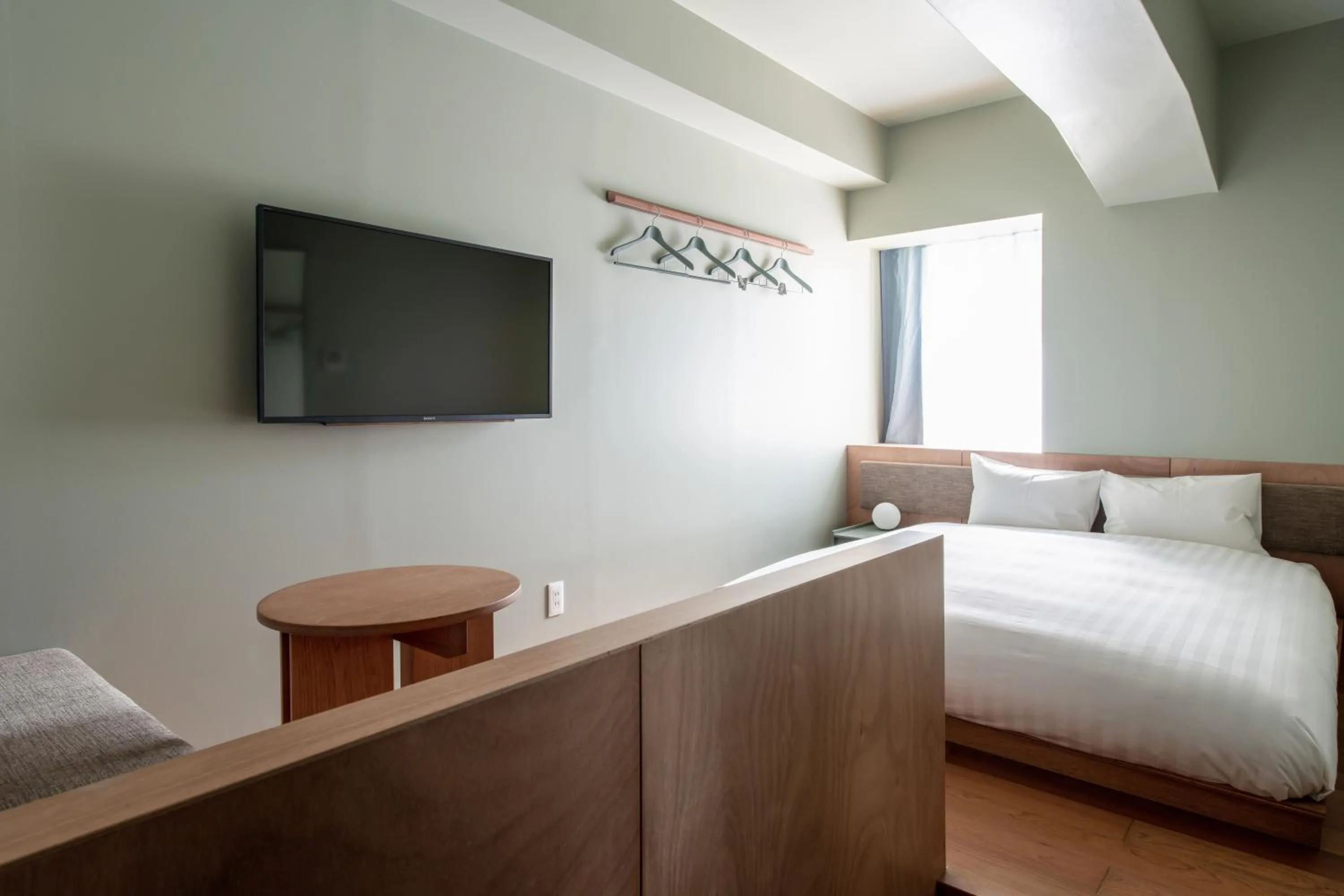 Photo of the whole room, Bed in KAIKA Tokyo by THE SHARE HOTELS