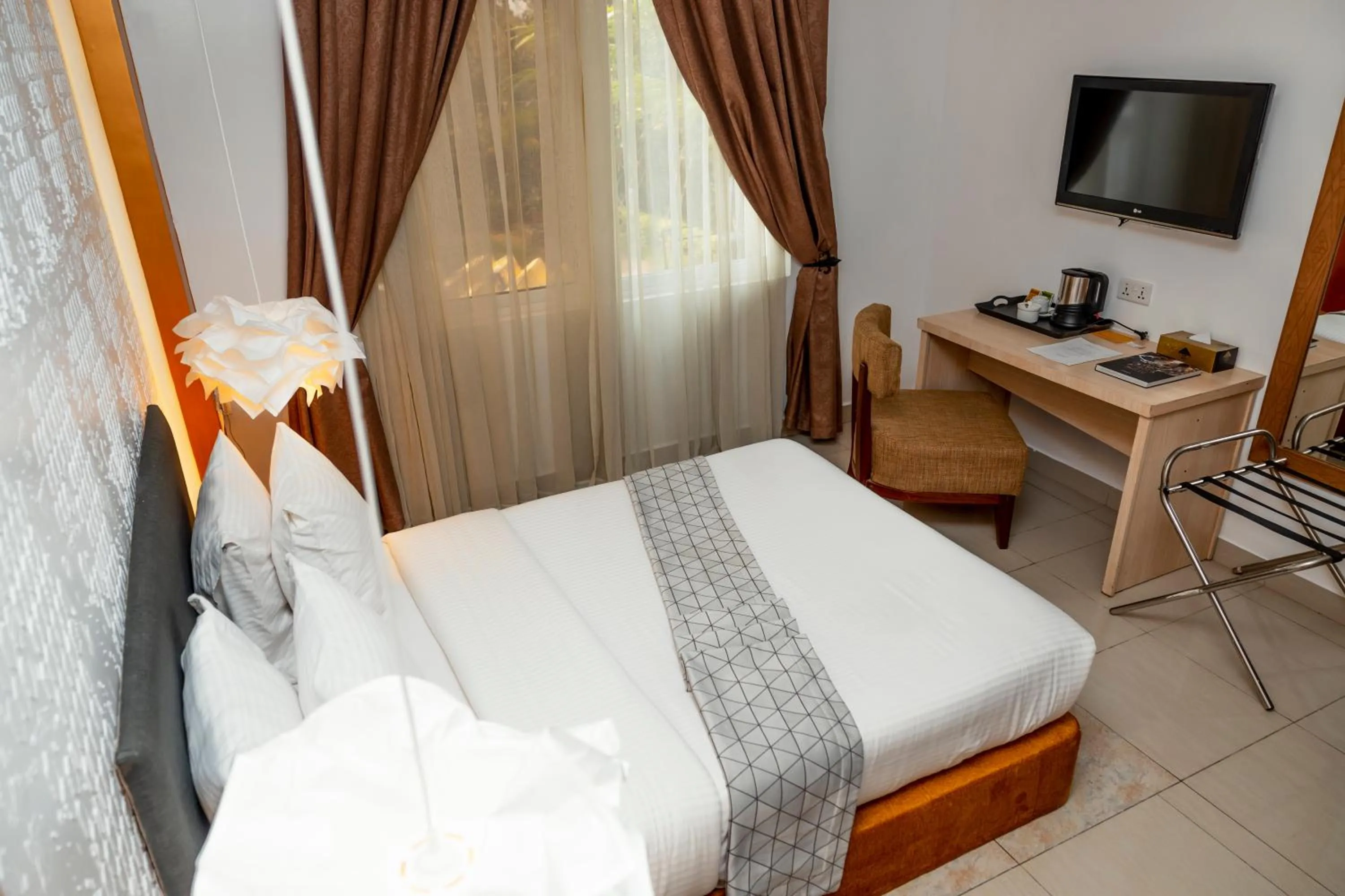 Bed in Amata n'Ubuki Boutique Hotel Ltd