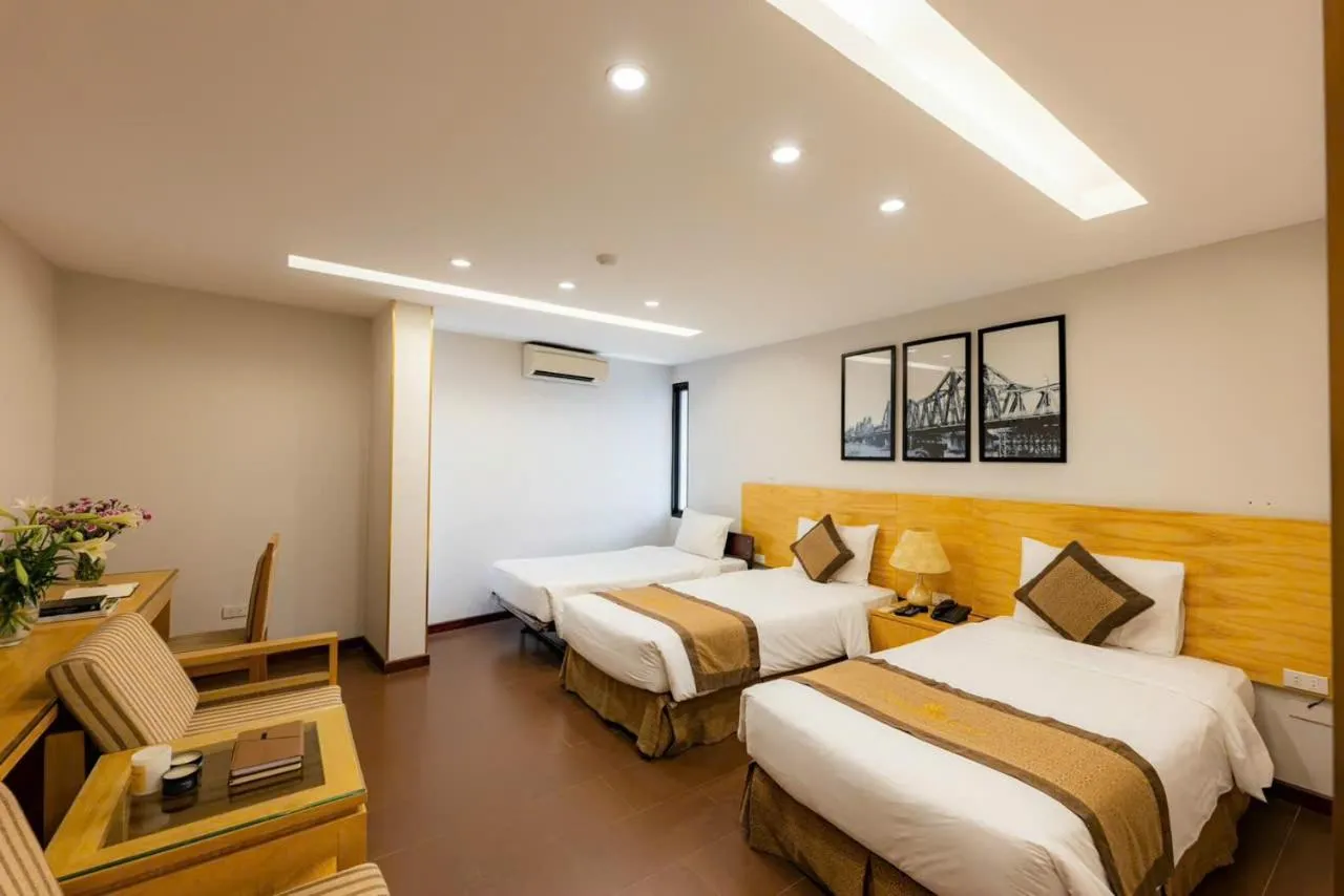 Bed in Riverside Hanoi Hotel