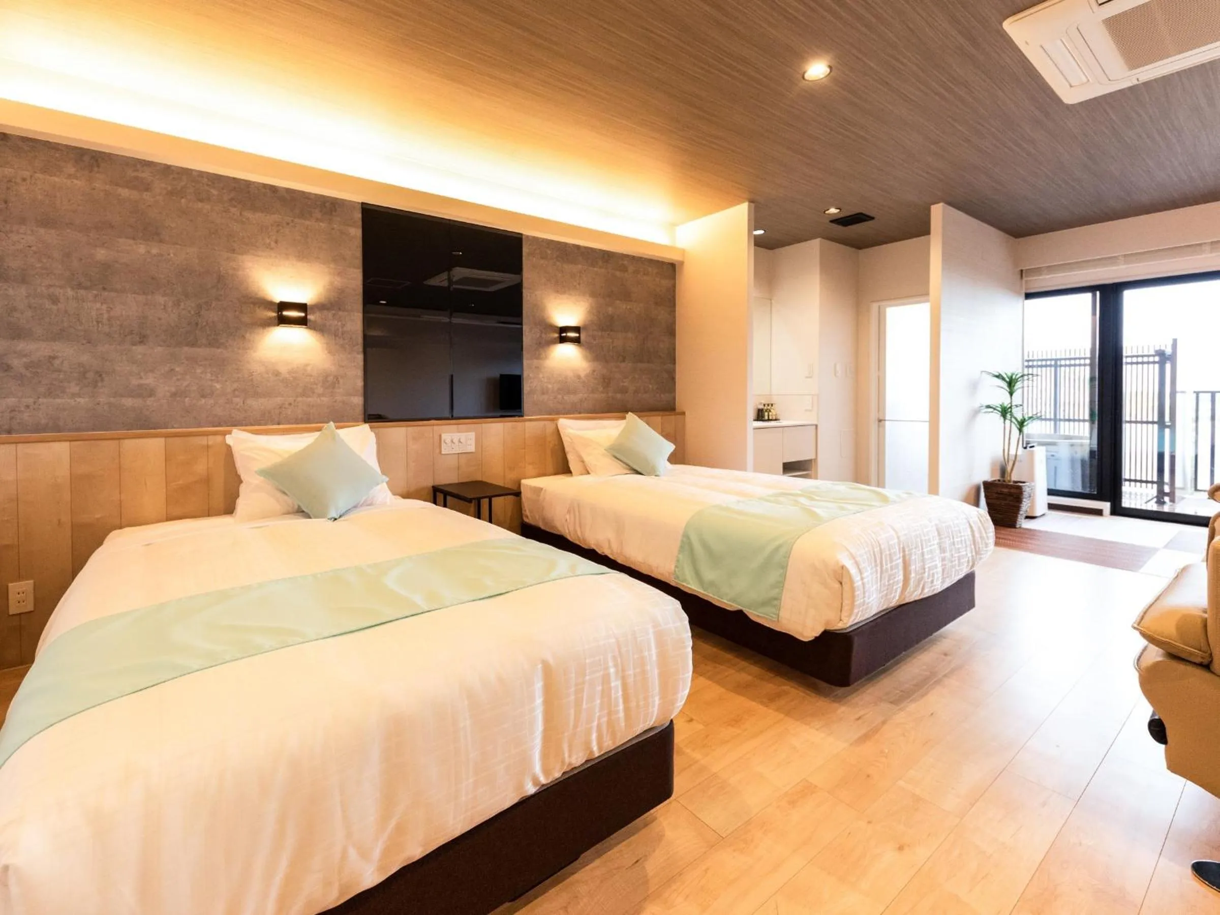 Bed in LiVEMAX RESORT Miyahama Ocean View