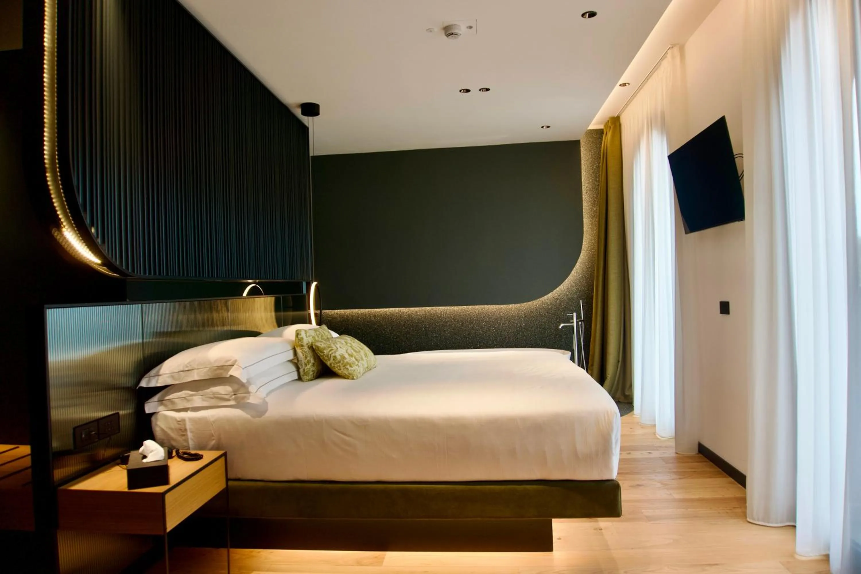 Bed in Hotel Ristorante Al Caminetto WorldHotels Crafted Adults Only