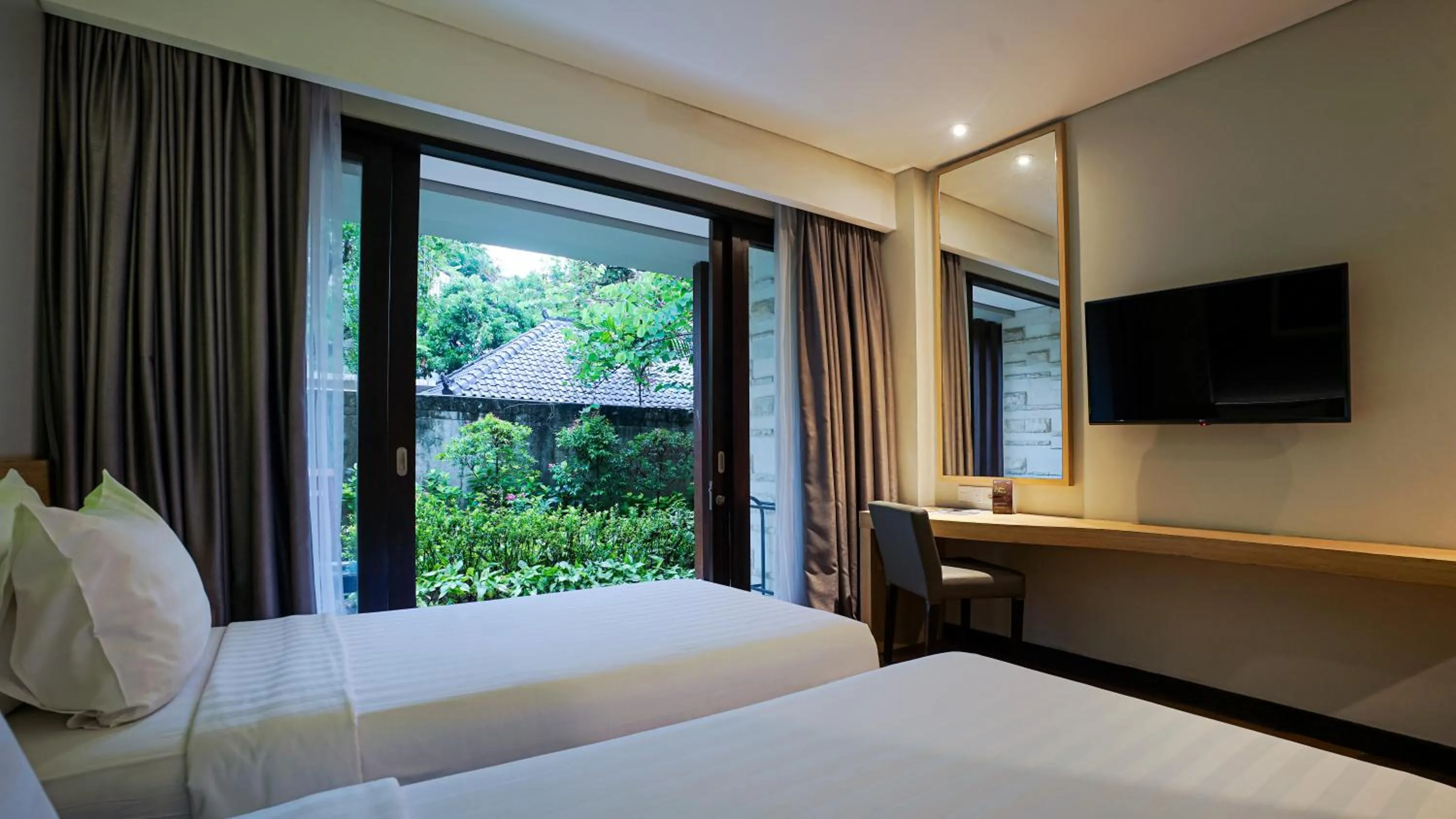 Bed in Grand Whiz Hotel Nusa Dua Bali