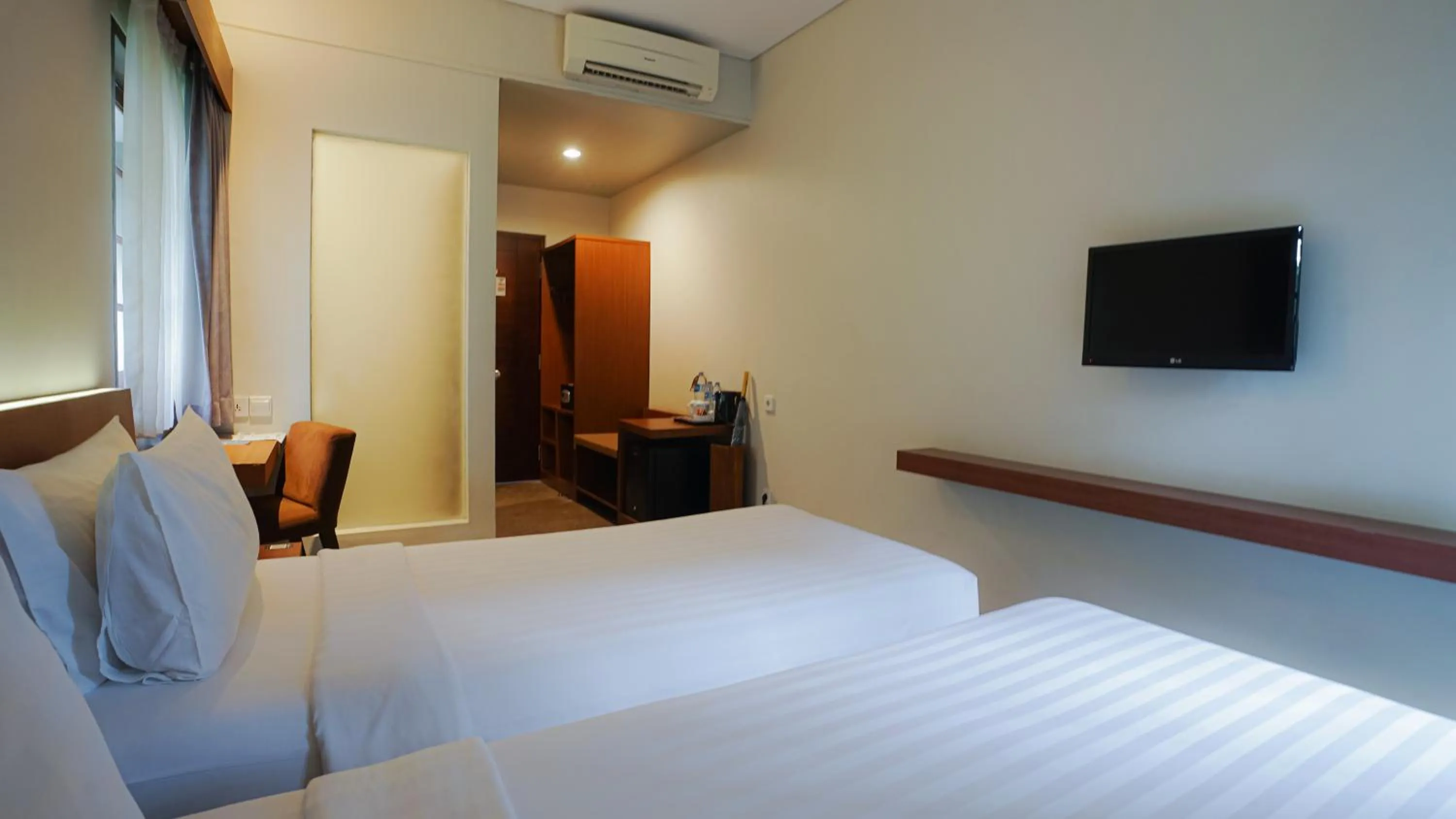Bed in Grand Whiz Hotel Nusa Dua Bali