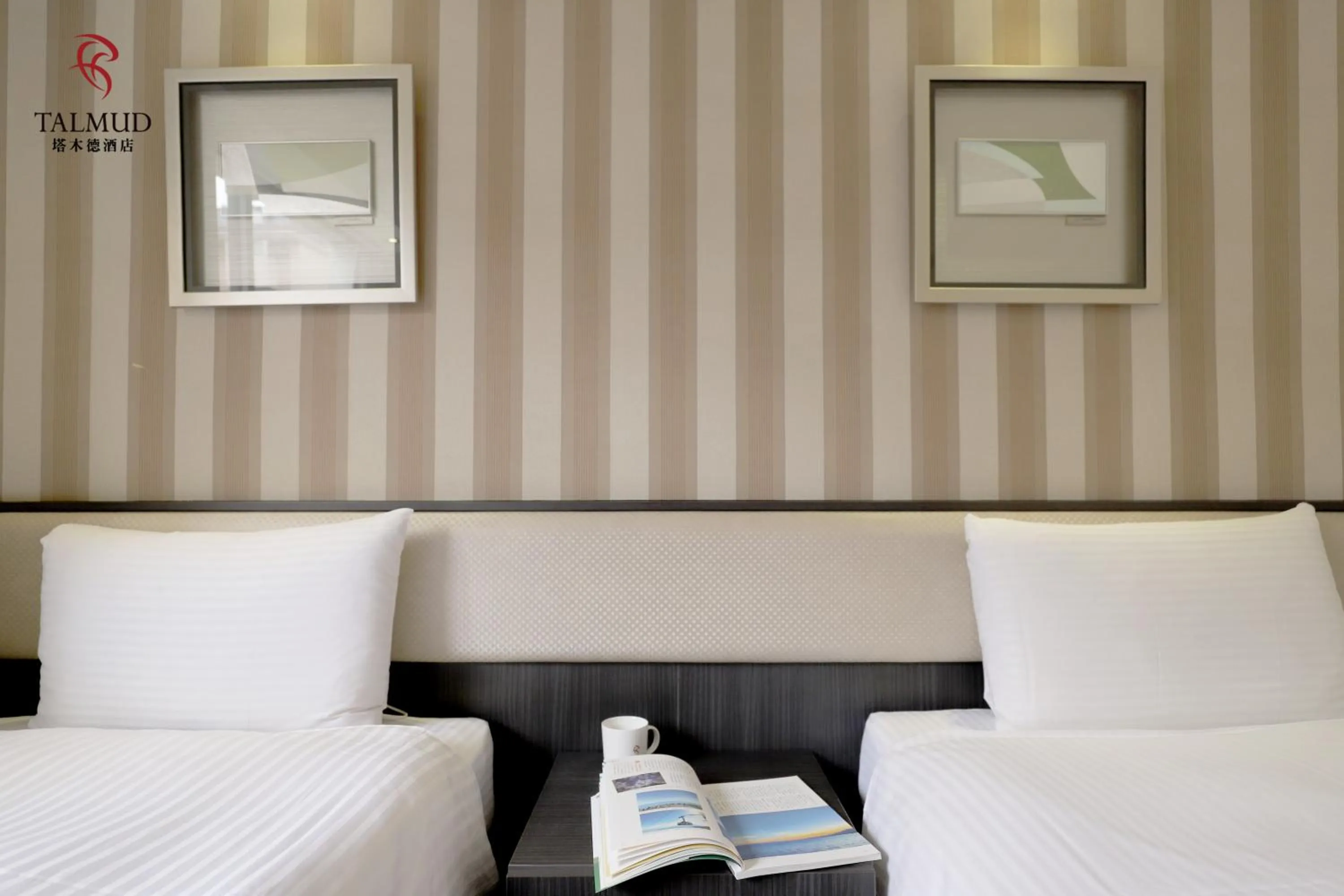 Photo of the whole room, Bed in Talmud Hotel Taichung