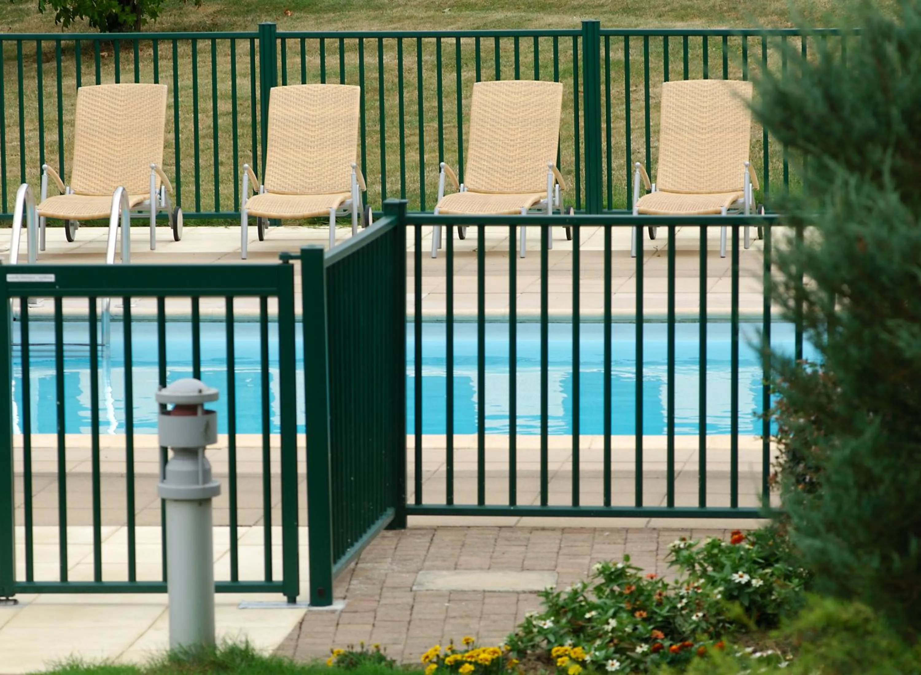 Swimming pool in Logis Hôtel & Restaurant L'ermitage