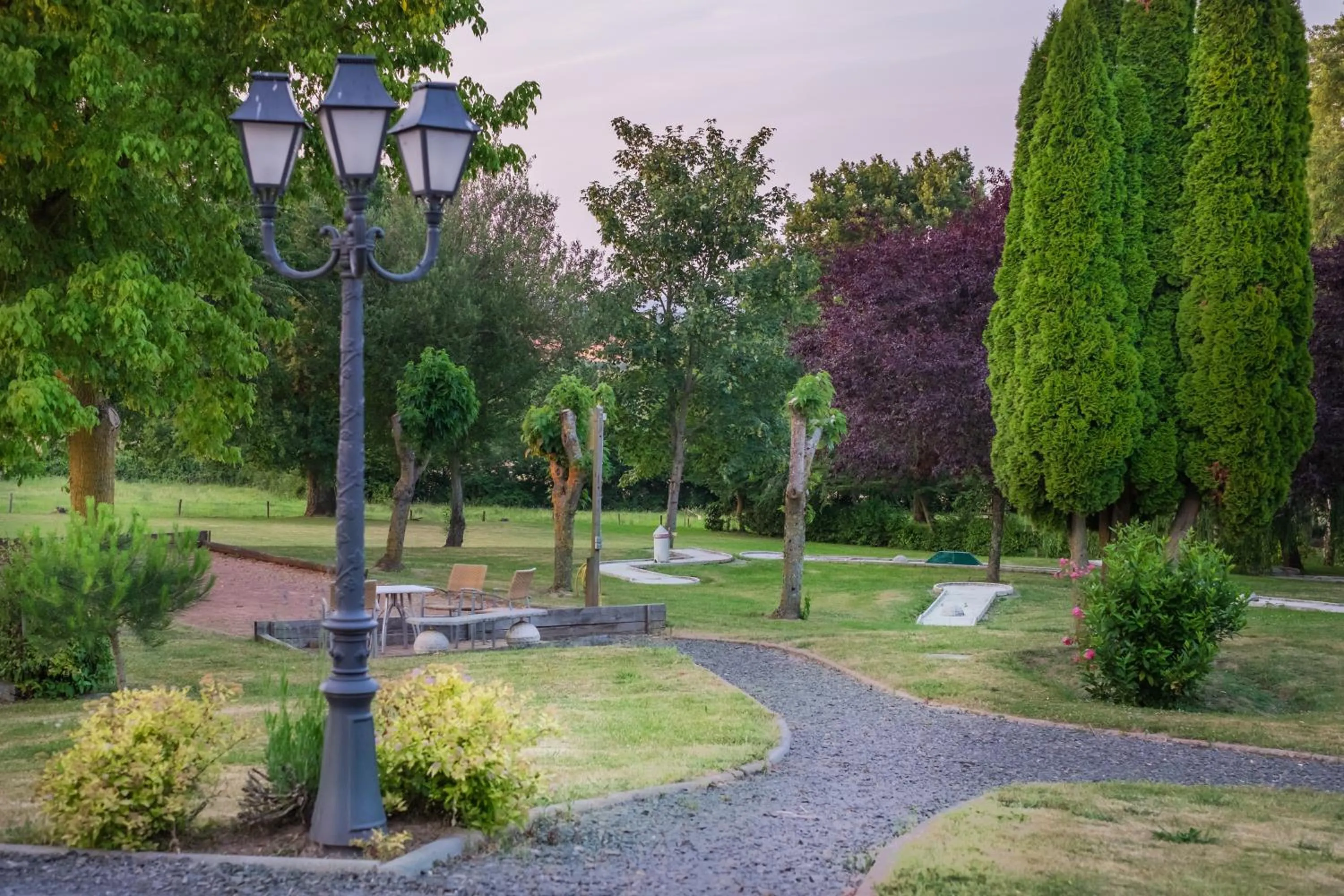 Garden view in Logis Hôtel & Restaurant L'ermitage