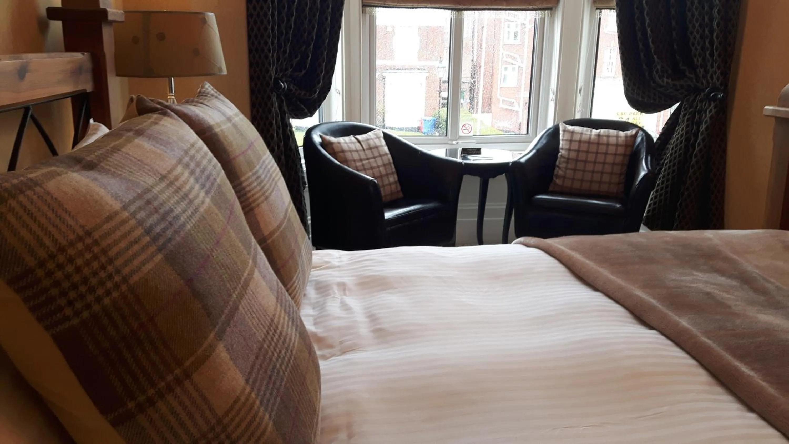 Bed in The Ambassador Townhouse