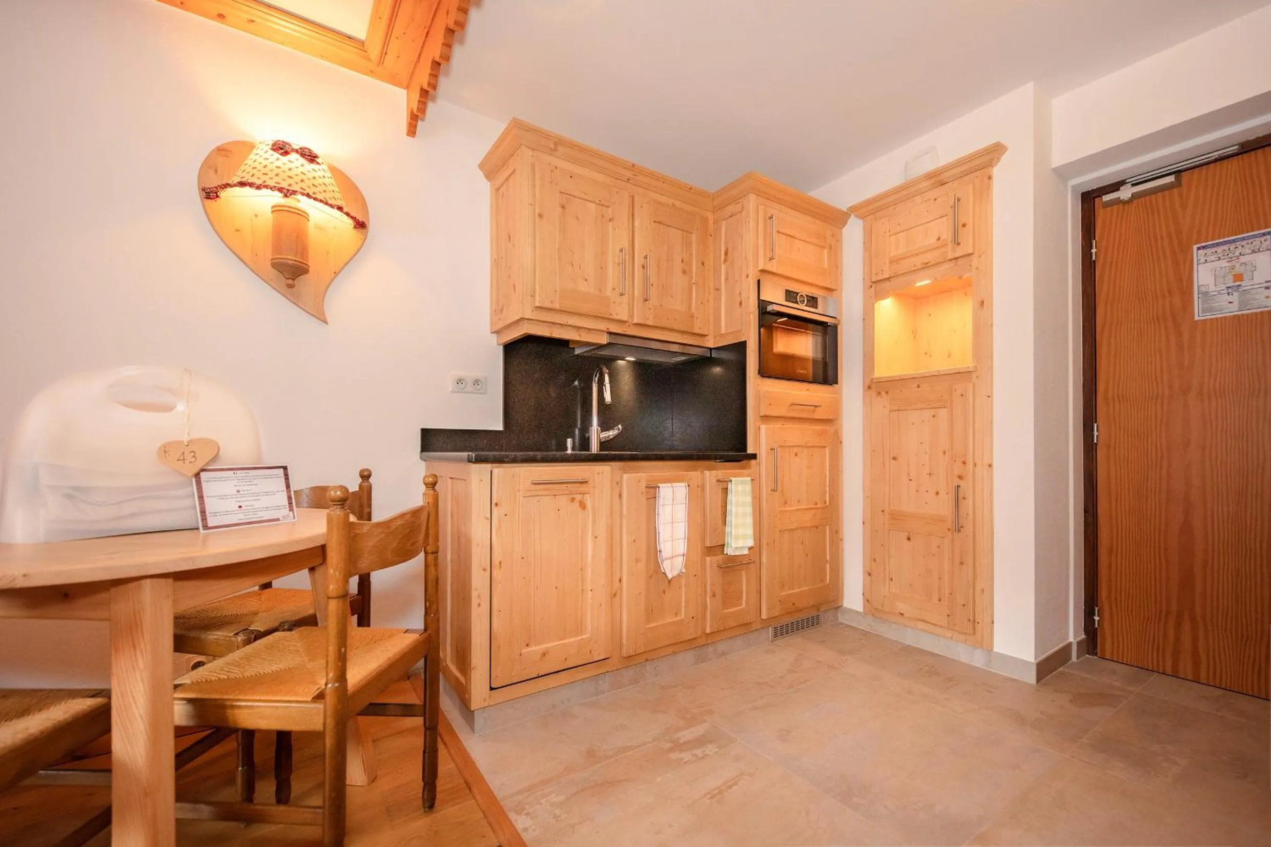 Kitchen or kitchenette in Chalet-Hôtel Neige et Roc, The Originals Relais