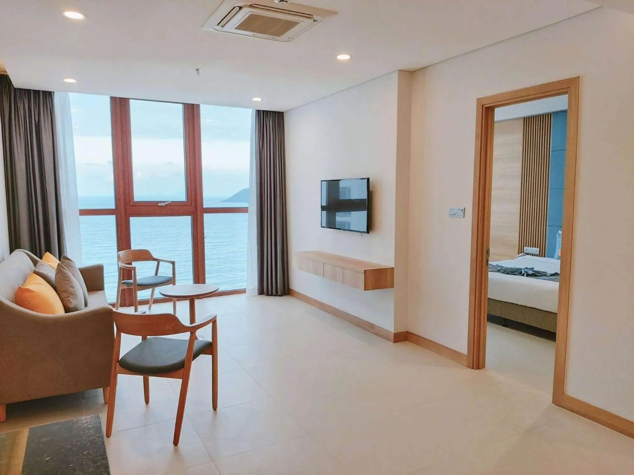 Seating area, Bed in Sun Kiss Hotel