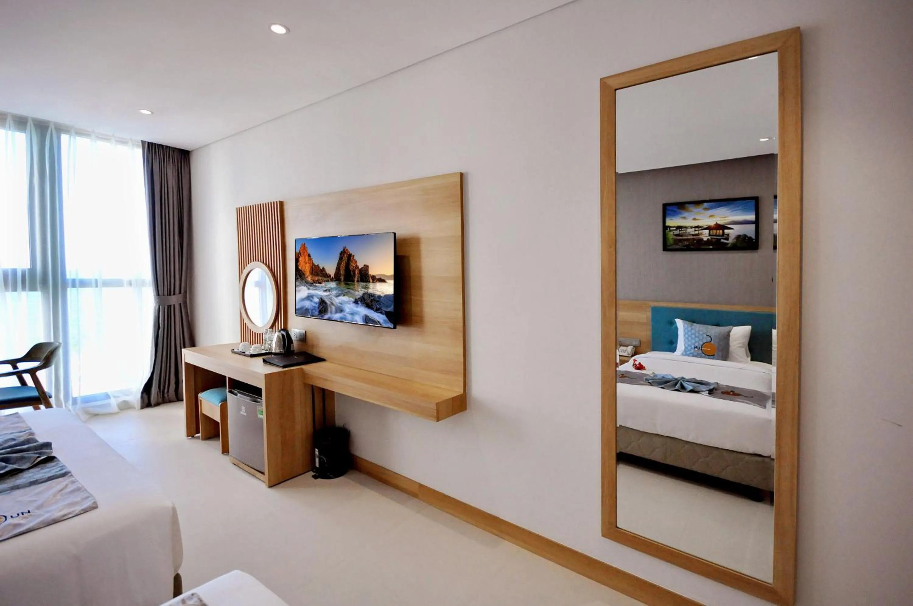 Communal lounge/ TV room, Bed in Sun Kiss Hotel