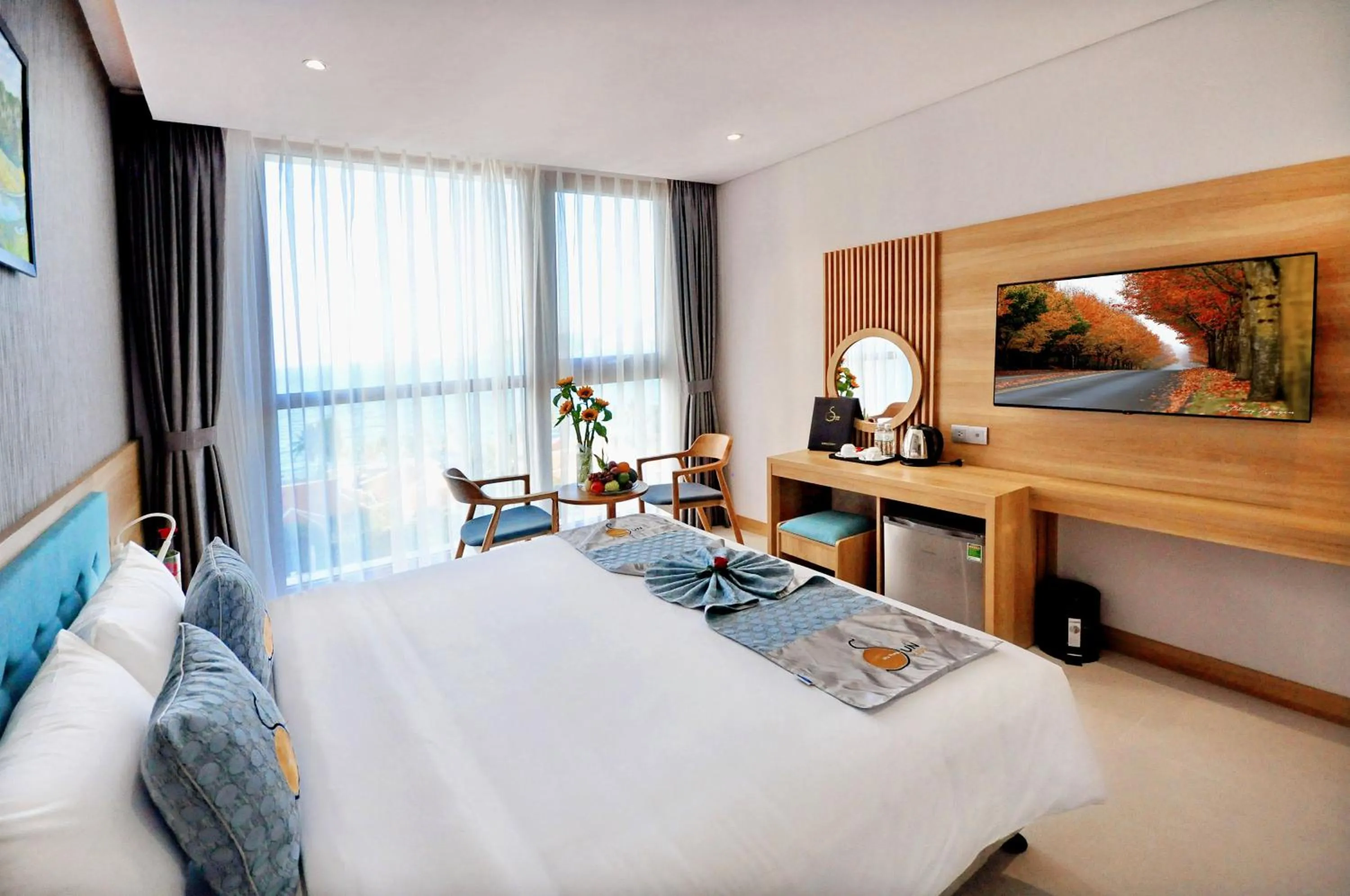 Communal lounge/ TV room, Bed in Sun Kiss Hotel