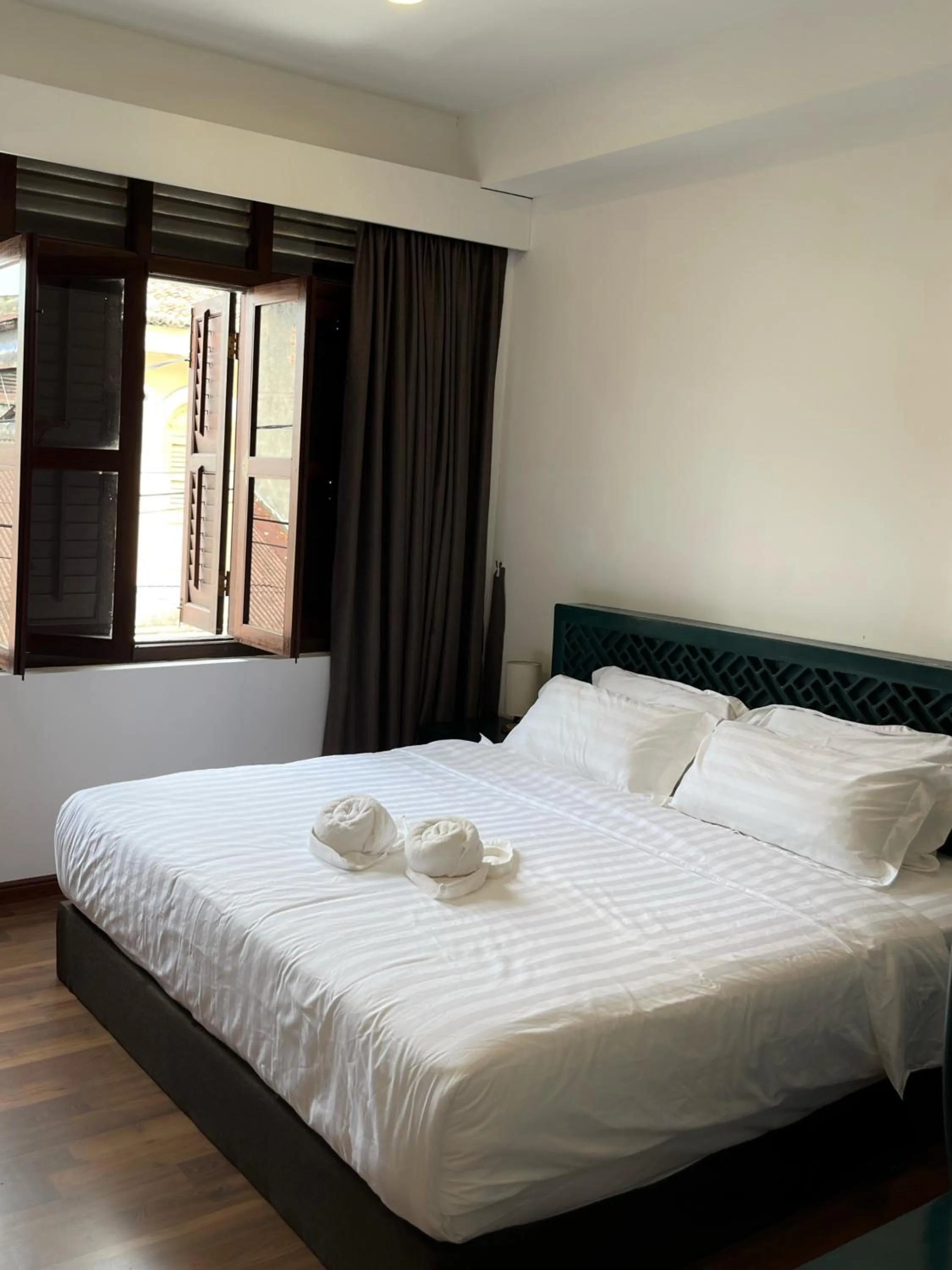 Bed in Mclane Boutique Hotel