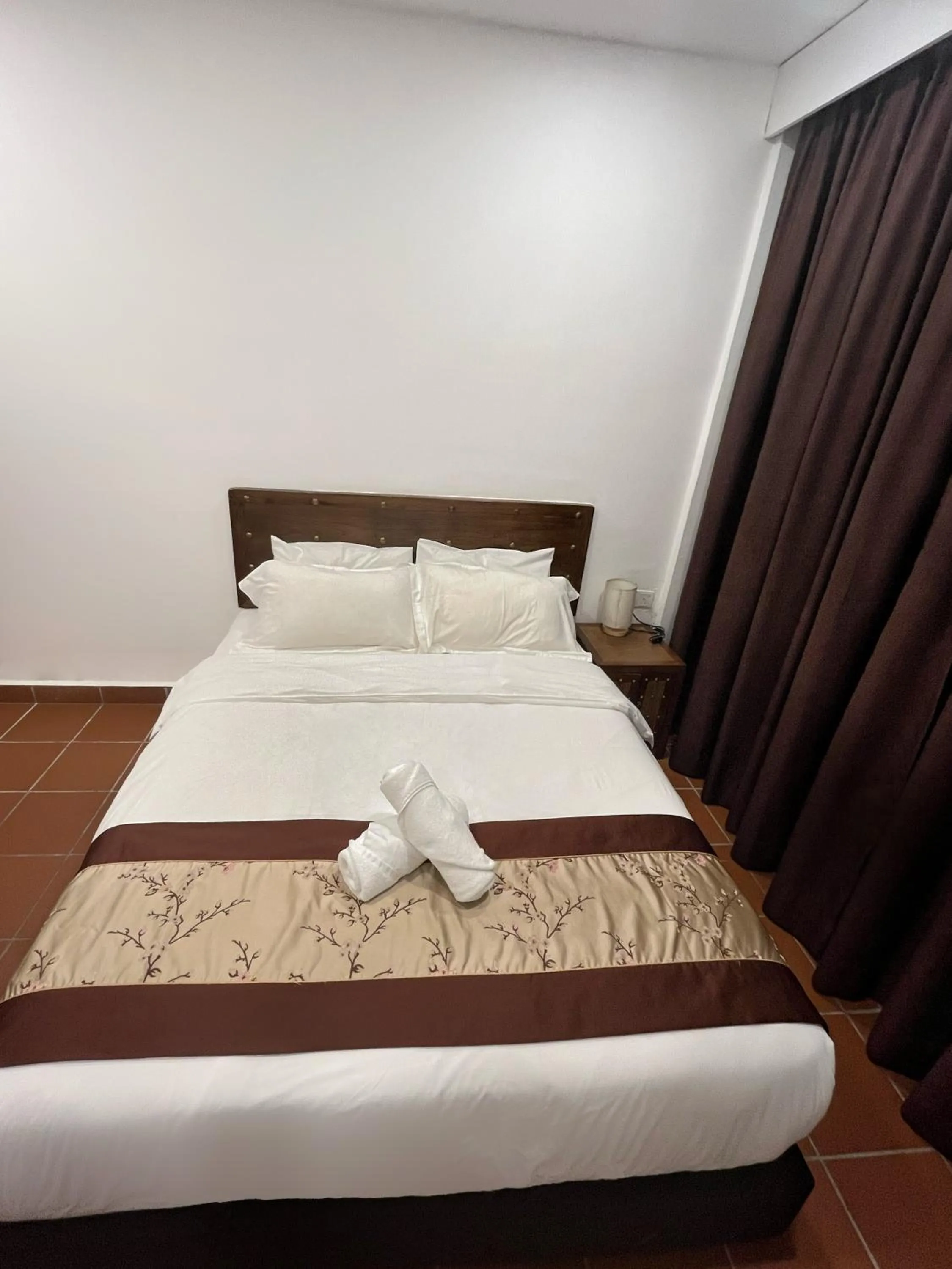 Bed in Mclane Boutique Hotel