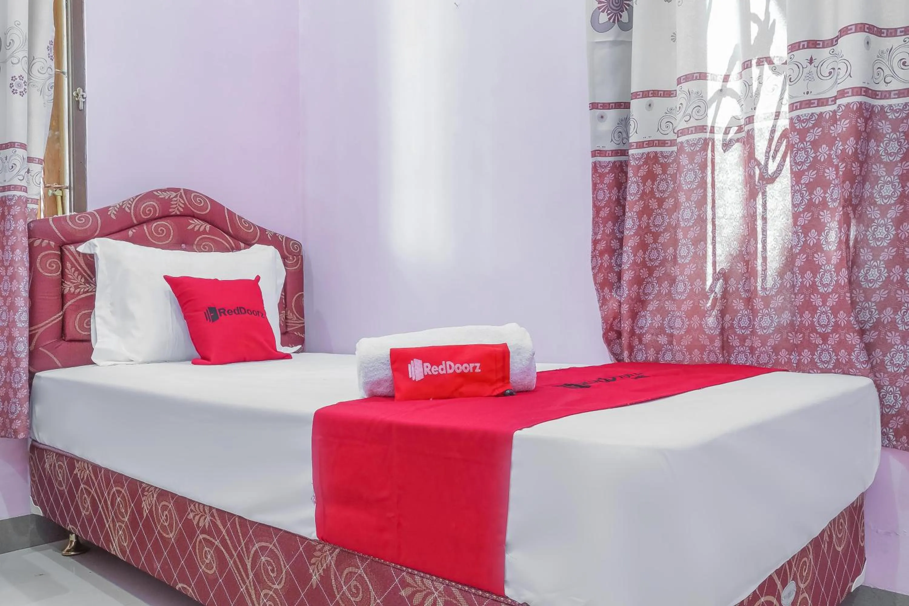 Bed in RedDoorz Syariah @ Puri Kalijaga Street