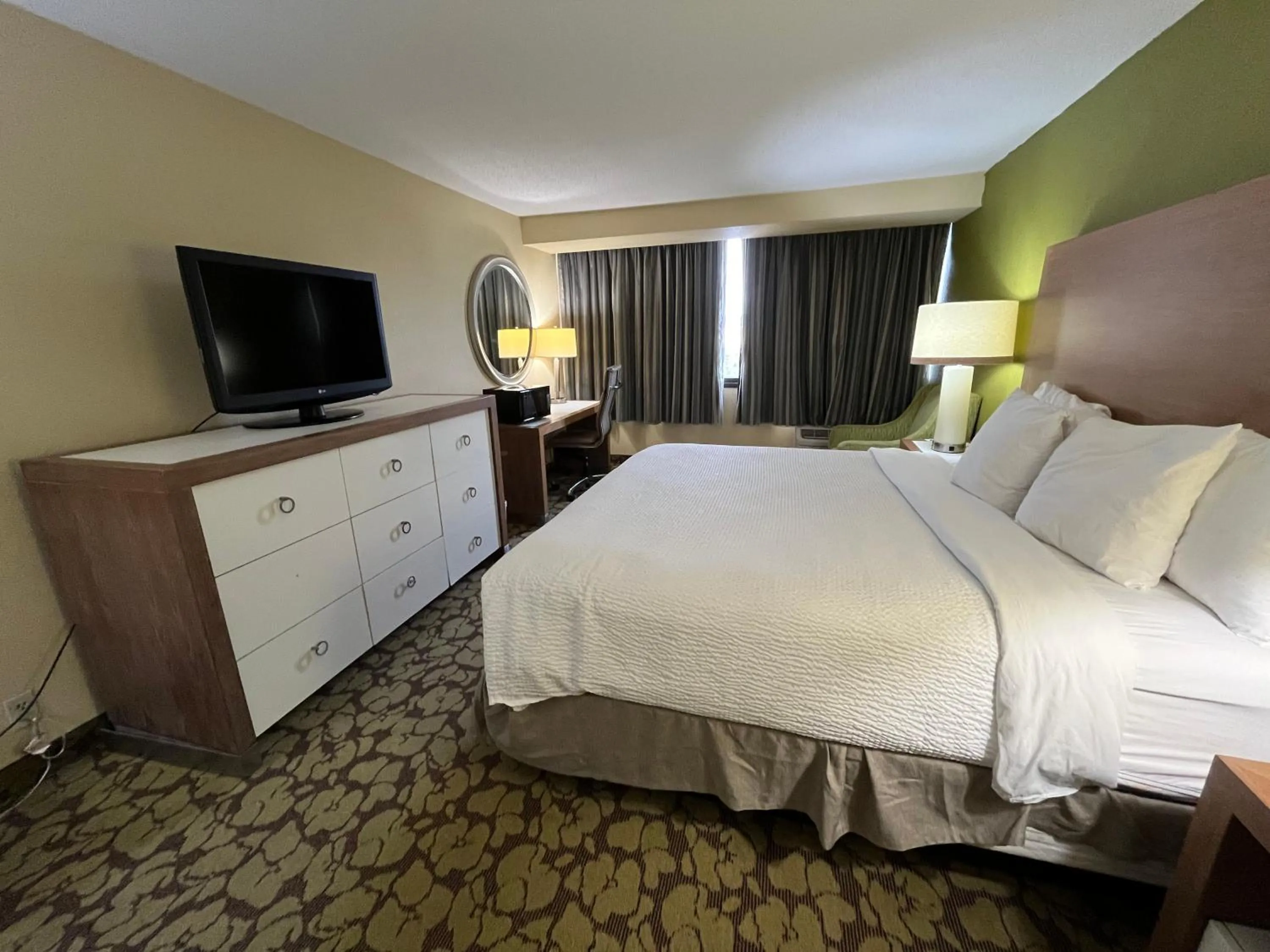 Photo of the whole room in Ramada Plaza by Wyndham Charlotte South End Airport