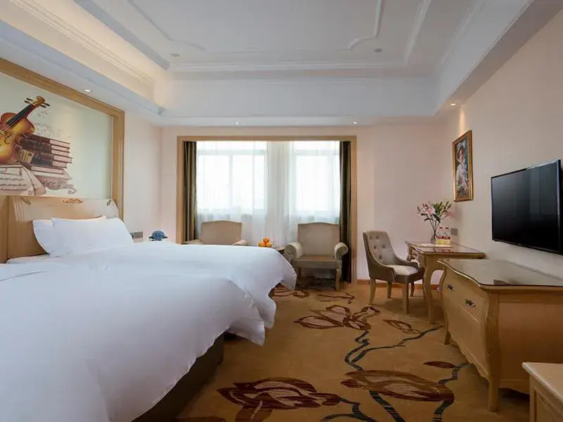 Bed in Vienna International Hotel (Fangchenggang Administration Center High-speed Railway Station) Bed in Vienna International Hotel (Fangchenggang Administration Center High-speed Railway Station)