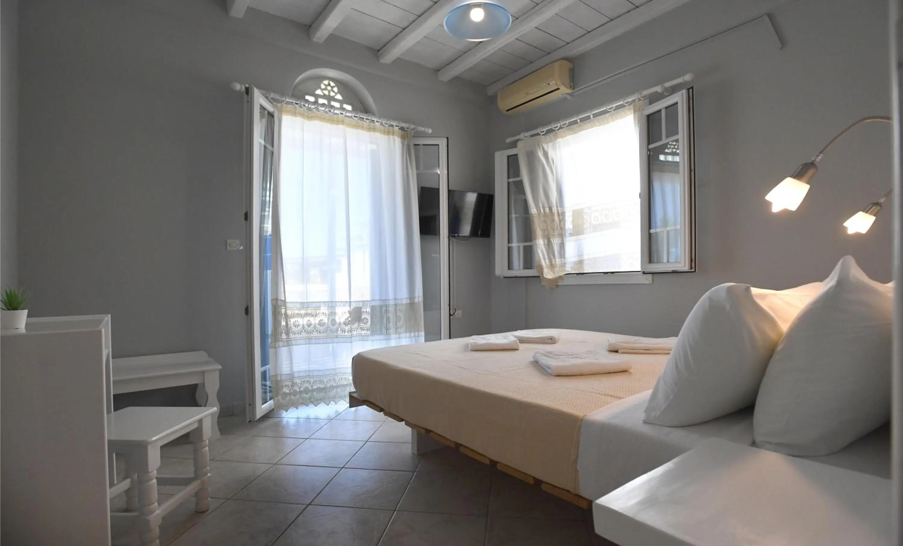 Bed in Nostos Beachfront Apartments & Studios
