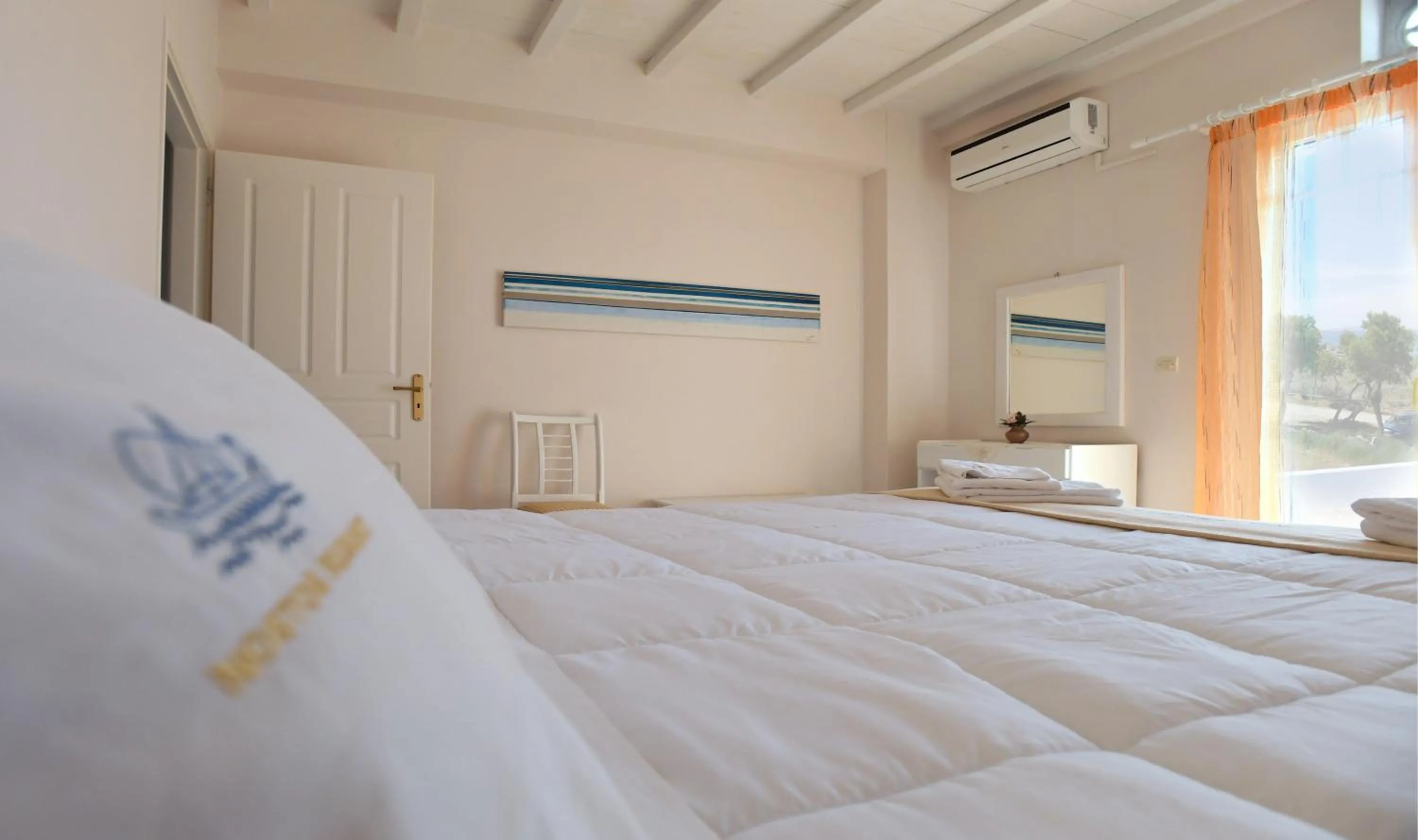 Bed in Nostos Beachfront Apartments & Studios