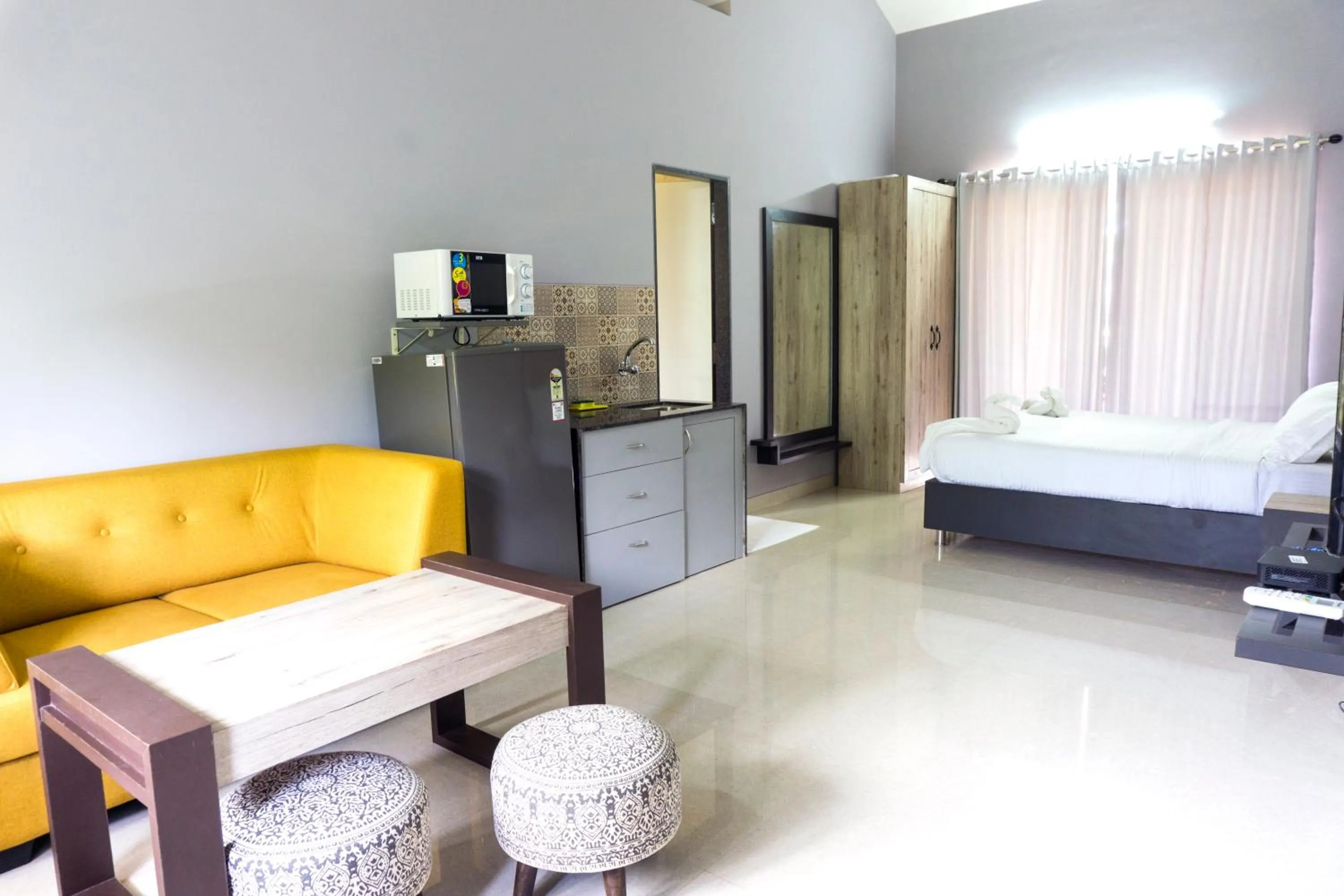 Seating area, Bed in Passions de Goa