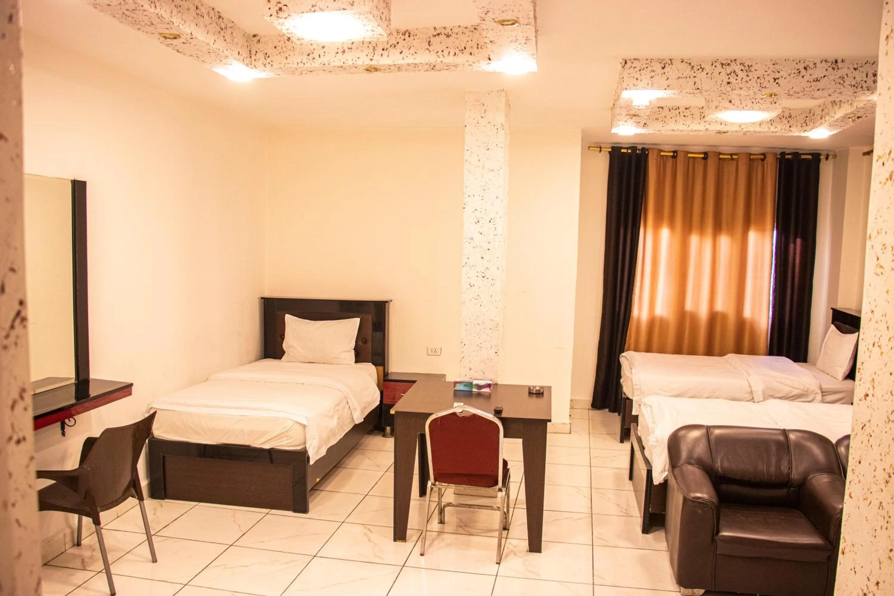 Bed in Sara Crown Hotel