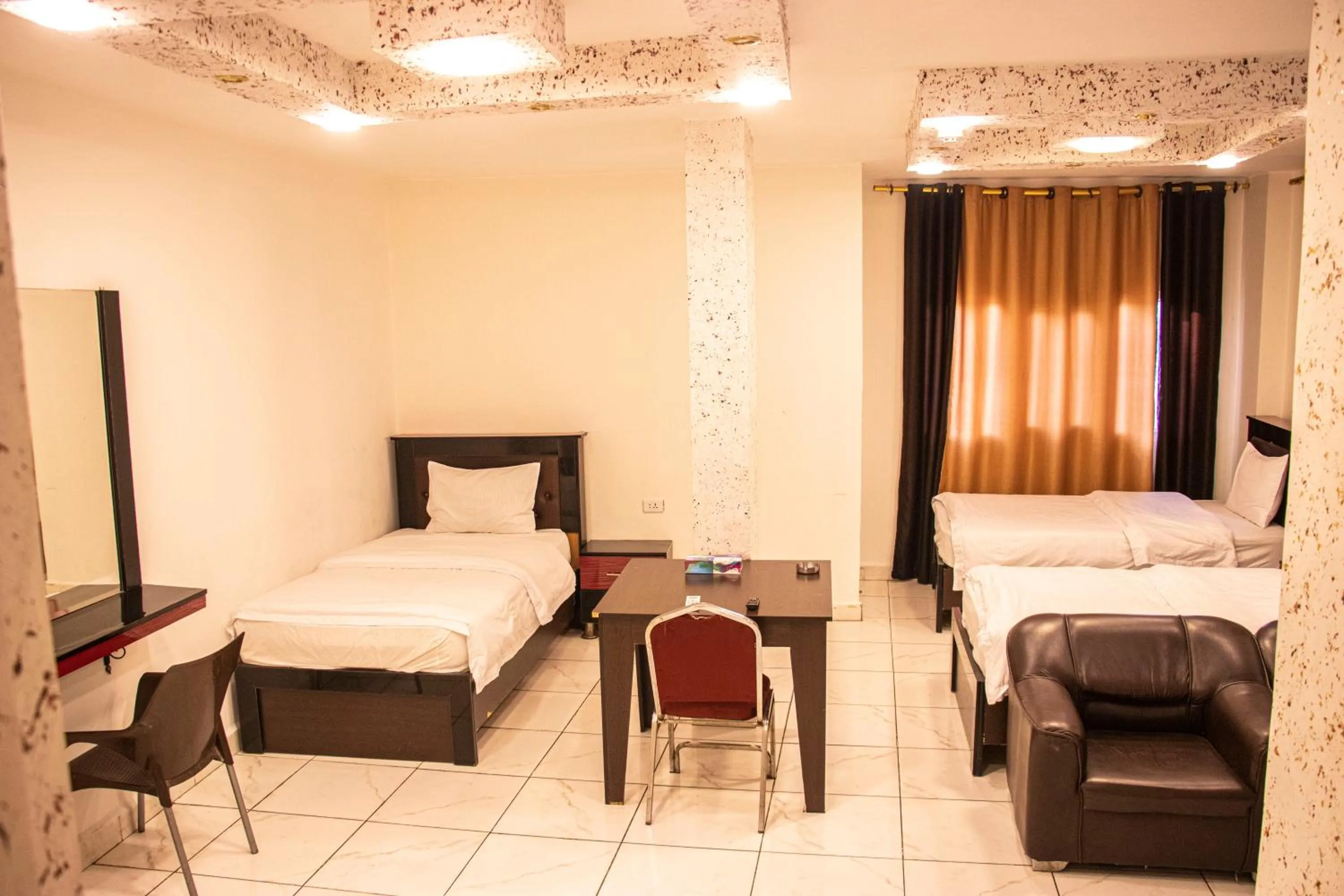 Bed in Sara Crown Hotel