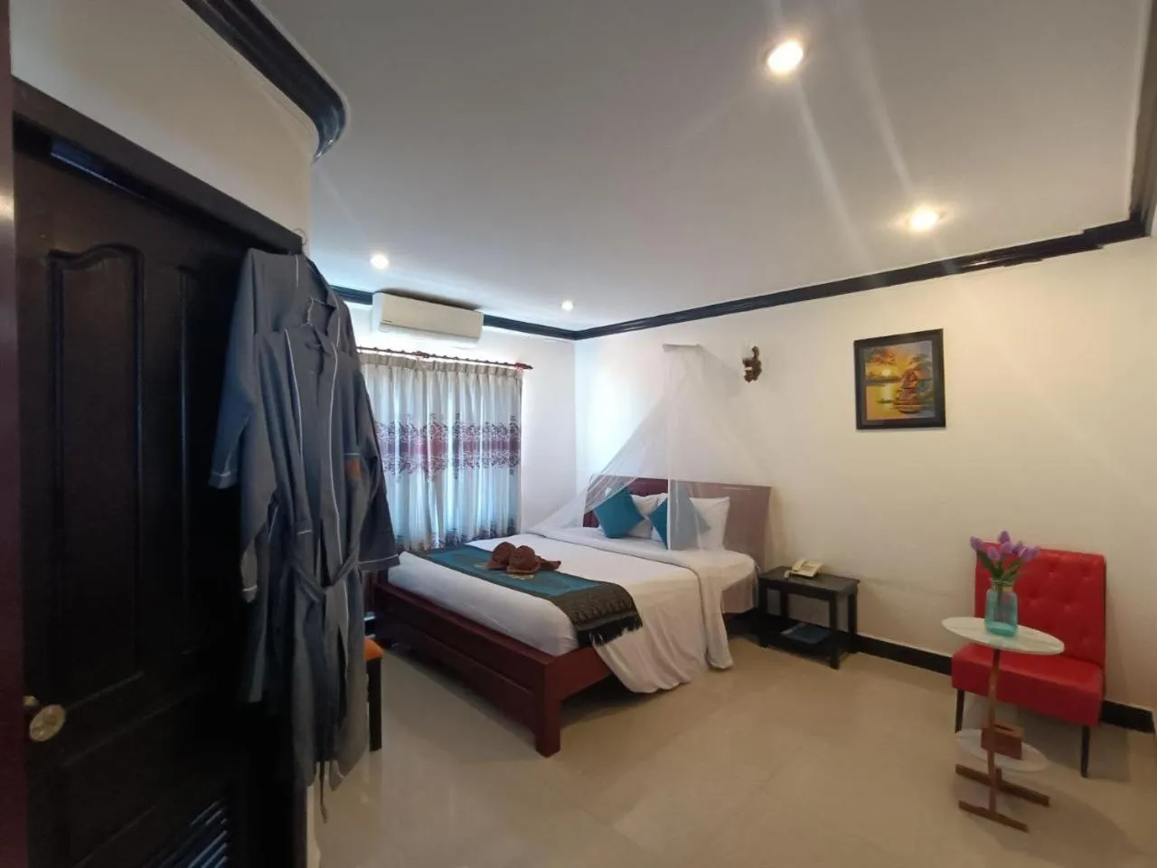 Bed in Parent Heritage Angkor Villa