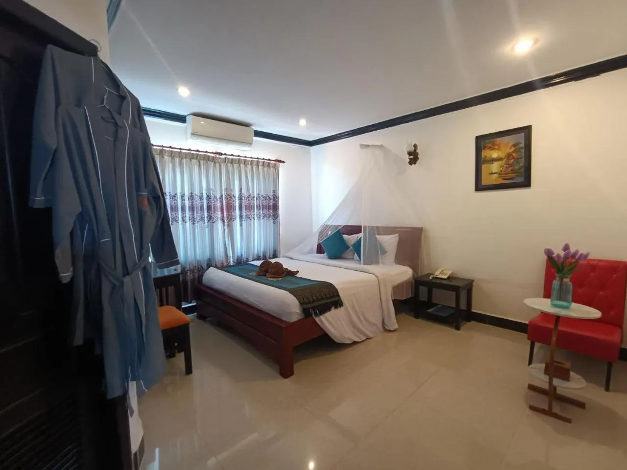 Bed in Parent Heritage Angkor Villa