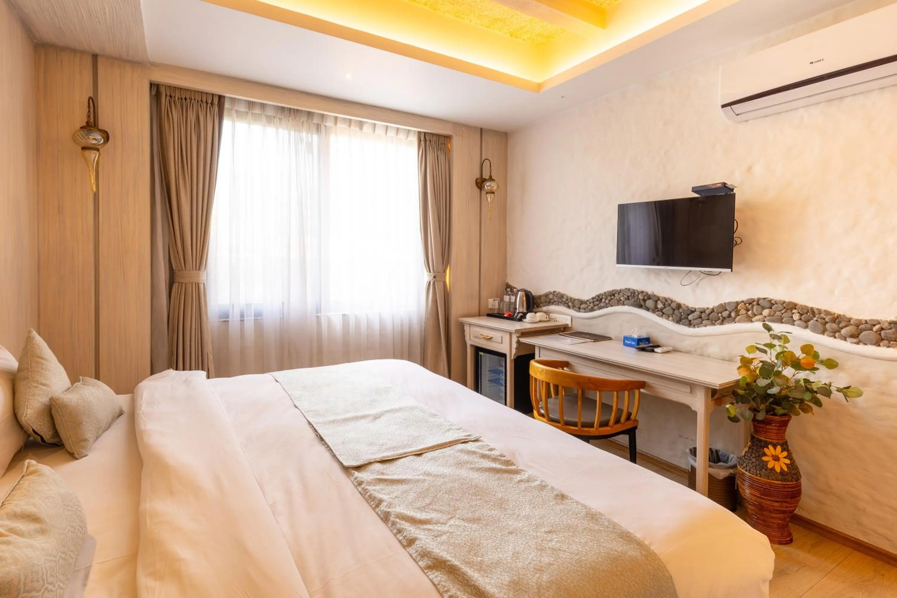 Bed in Arushi Boutique Hotel